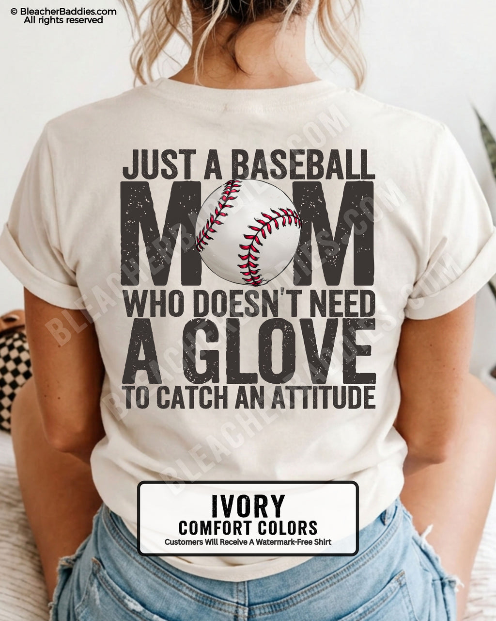 Ivory Comfort Colors game day shirt worn by woman showing distressed back graphic reading “Just a Baseball Mom Who Doesn’t Need A Glove To Catch An Attitude” with baseball illustration layered over MOM text