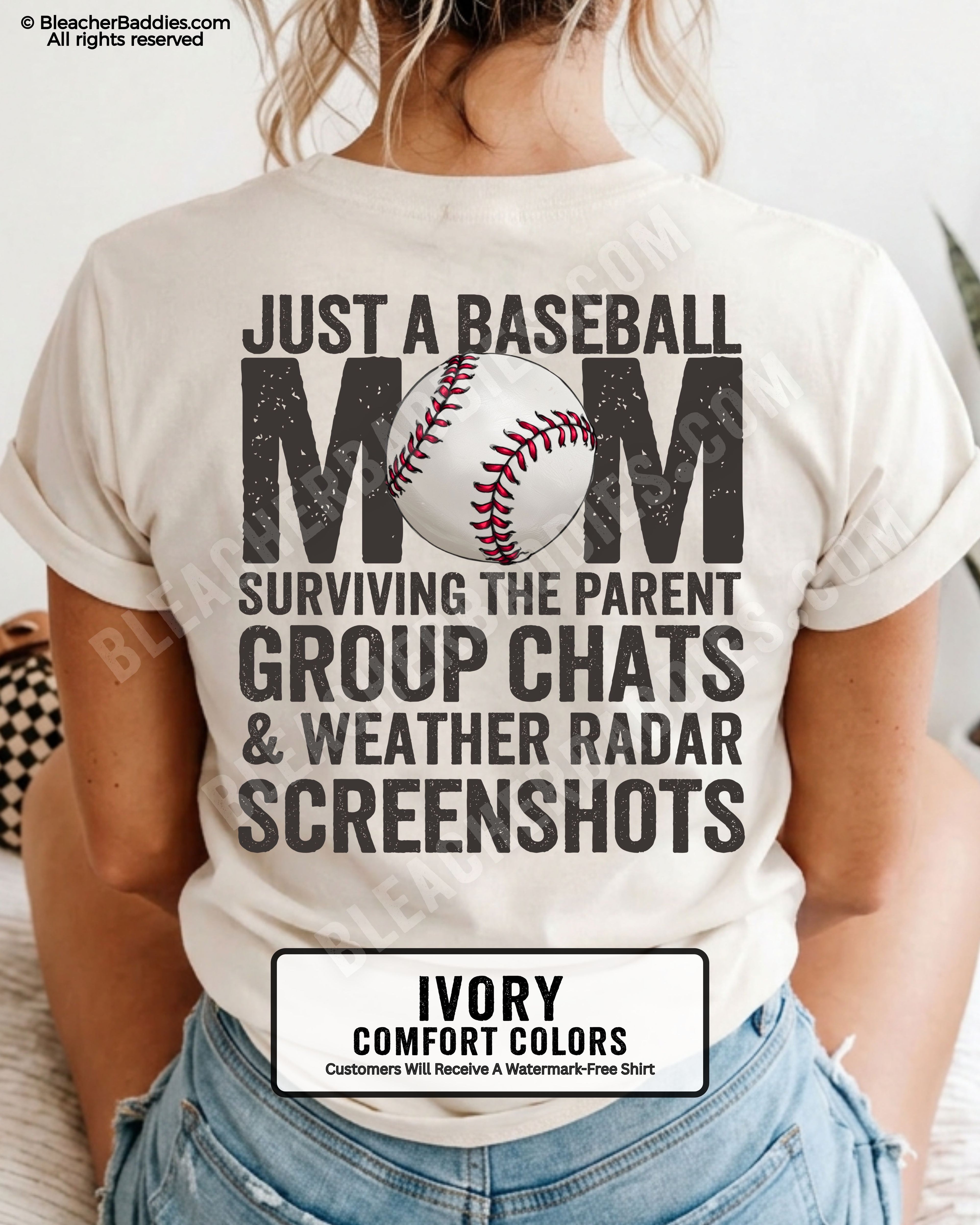Ivory Comfort Colors game day shirt worn by woman showing distressed back graphic reading “Just a Baseball Mom Surviving the Parent Group Chats & Weather Radar Screenshots” with baseball illustration over MOM text
