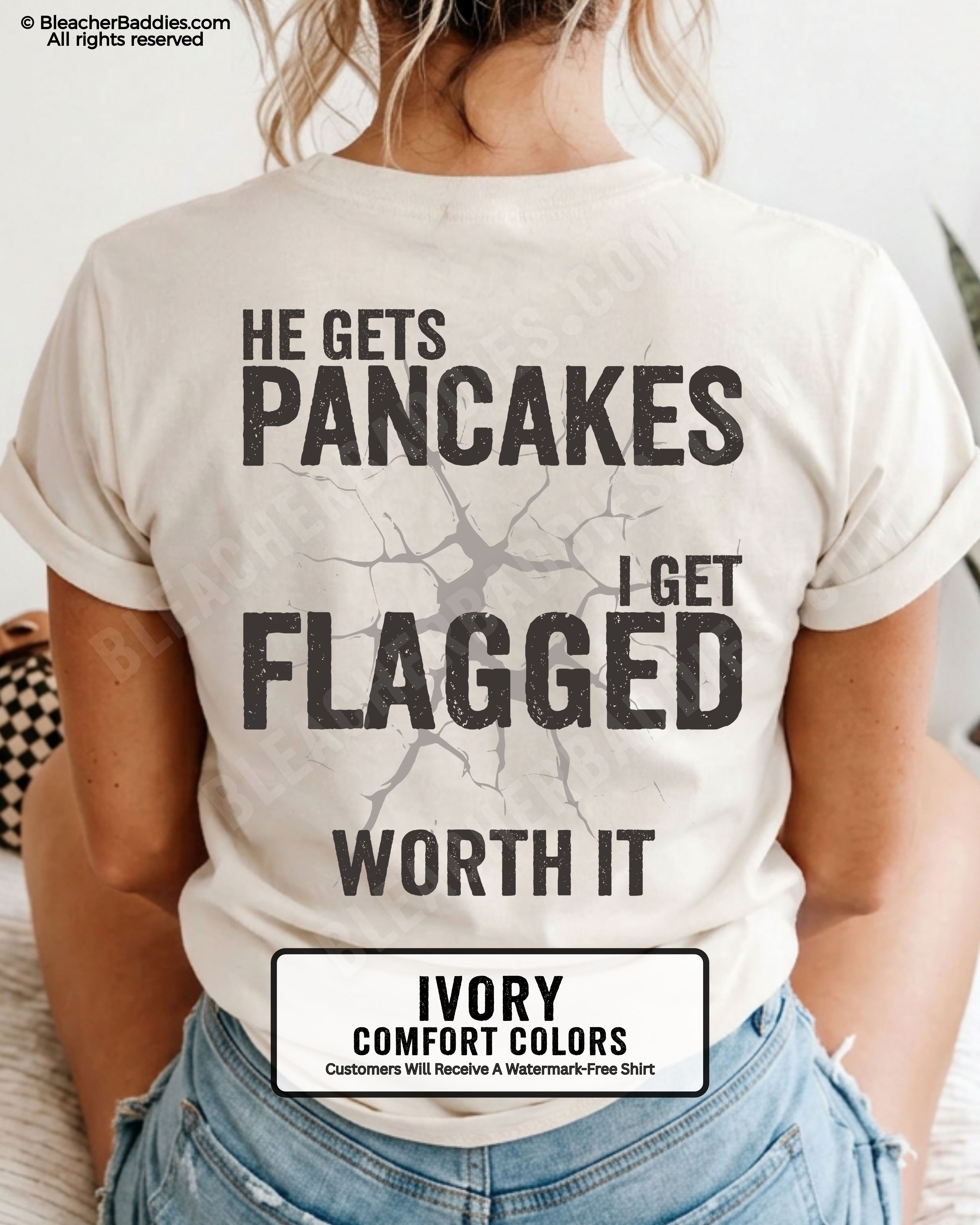 Football mom game day shirt in IVORY with back design that reads “He gets pancakes I get flagged worth it” in distressed black text with cracked graphic