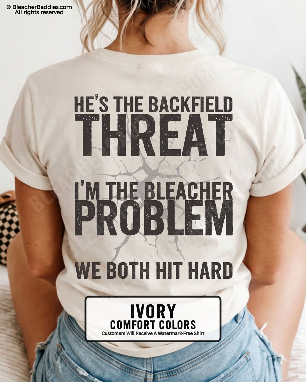 Back view of football mom wearing IVORY Comfort Colors game day shirt with “He’s the Backfield Threat I’m the Bleacher Problem We Both Hit Hard” graphic design