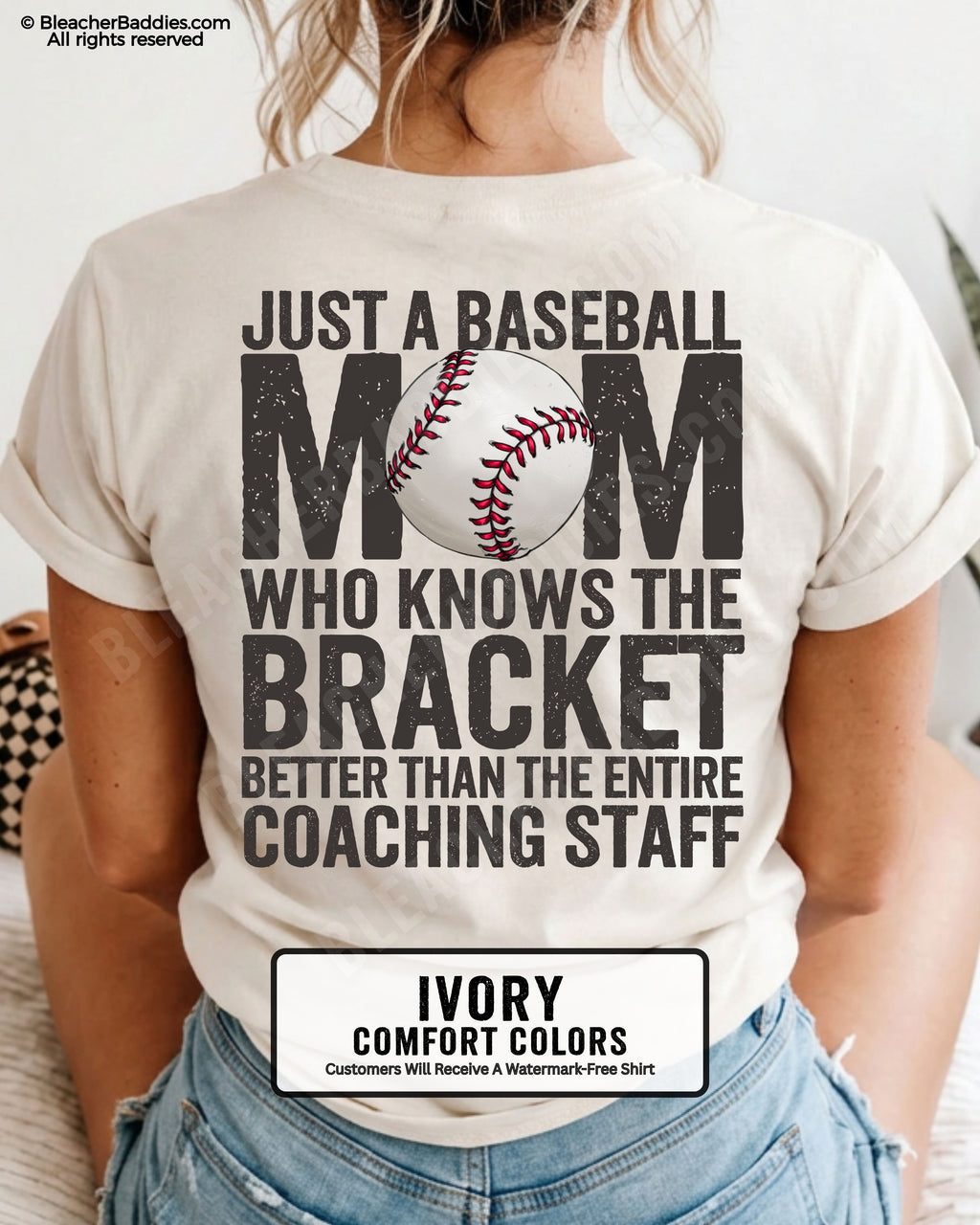 Ivory  baseball mom graphic tee featuring distressed black back design reading “Just a baseball mom who knows the bracket better than the entire coaching staff” with baseball illustration centered in MOM