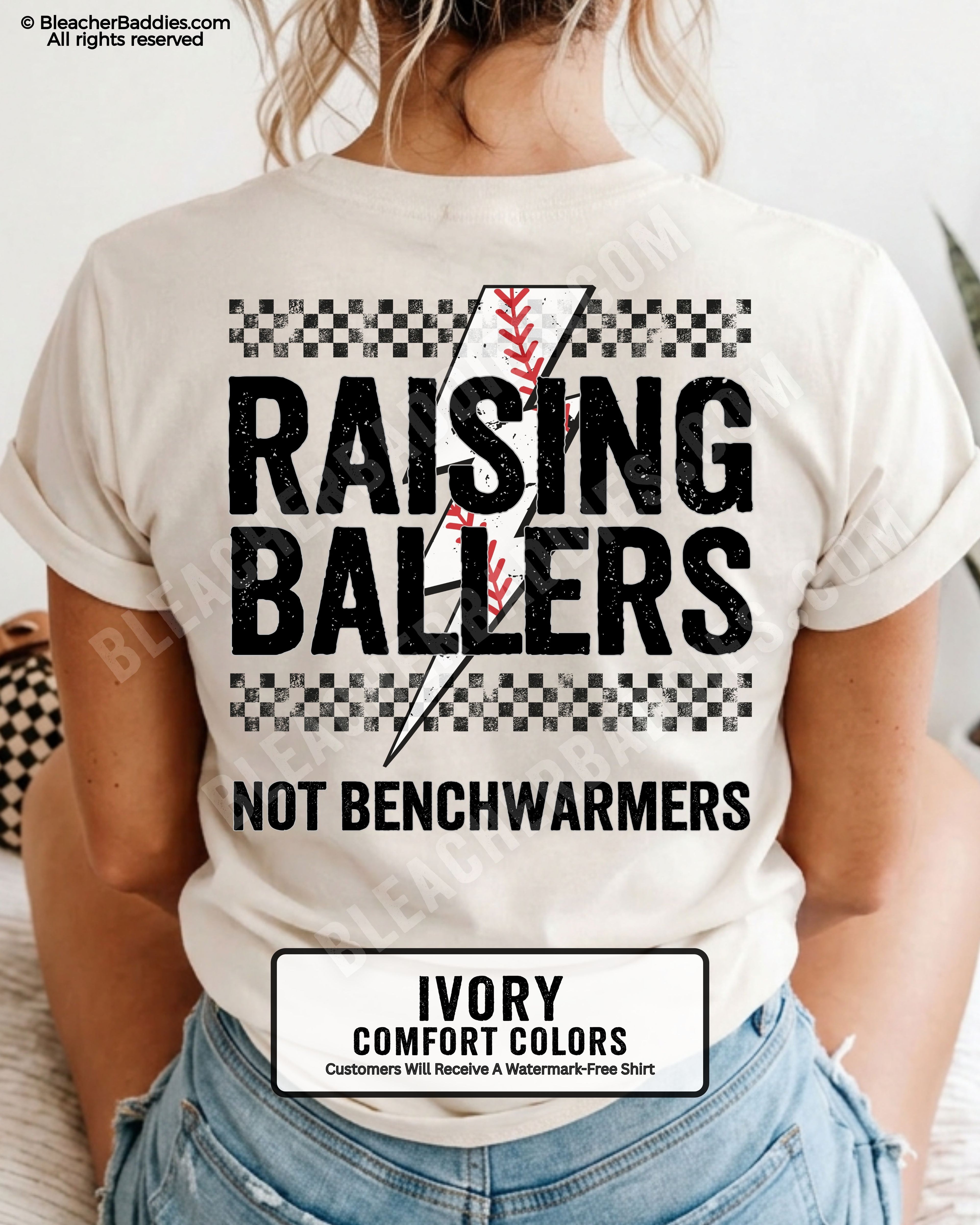 Ivory Comfort Colors baseball mom shirt with large distressed Raising Ballers back graphic featuring checkerboard stripes, red baseball seam detail, and “Not Benchwarmers” slogan.