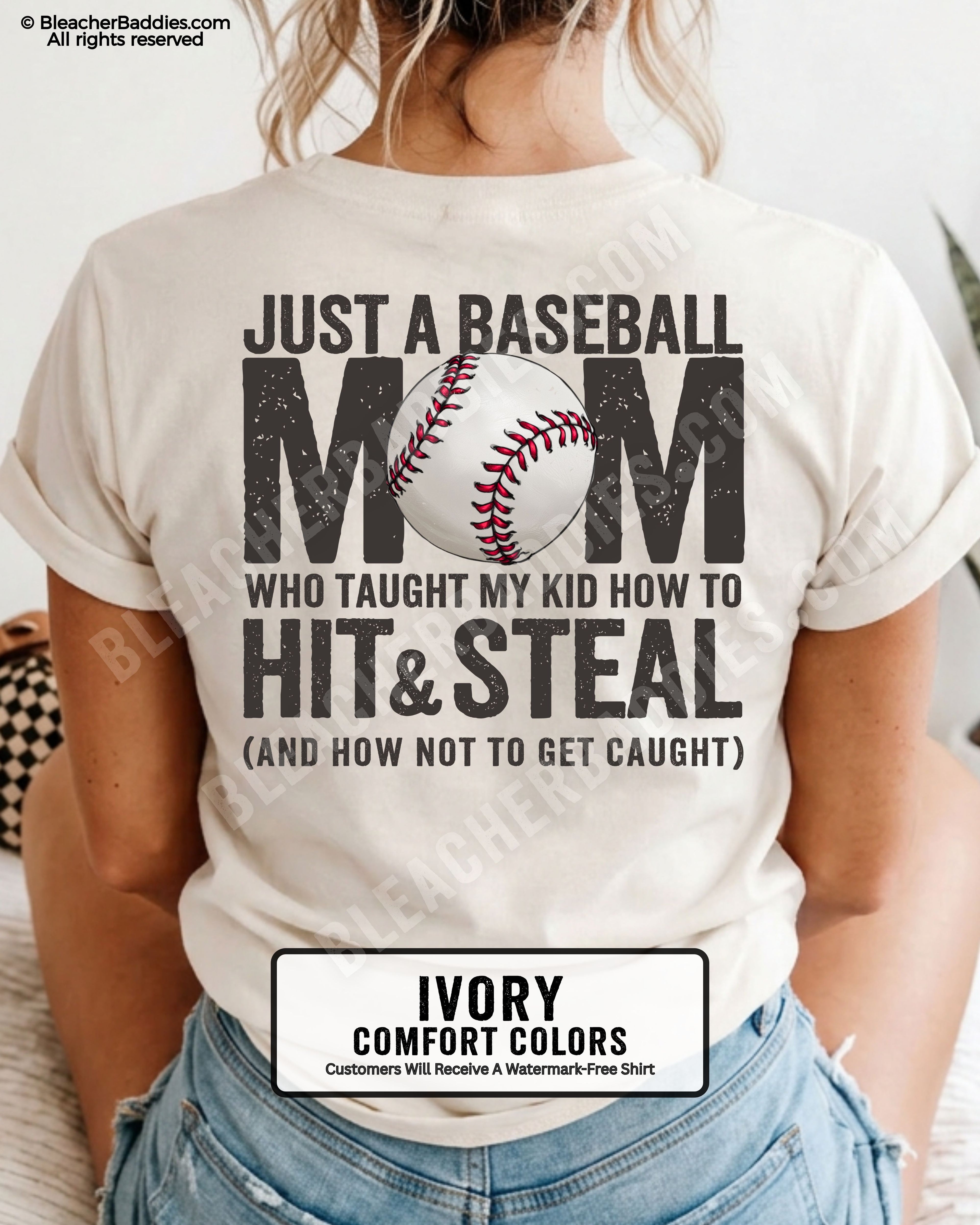 Ivory Comfort Colors game day shirt worn by woman showing distressed back graphic reading “Just a Baseball Mom Who Taught My Kid How to Hit & Steal (And How Not to Get Caught)” with baseball illustration over MOM text