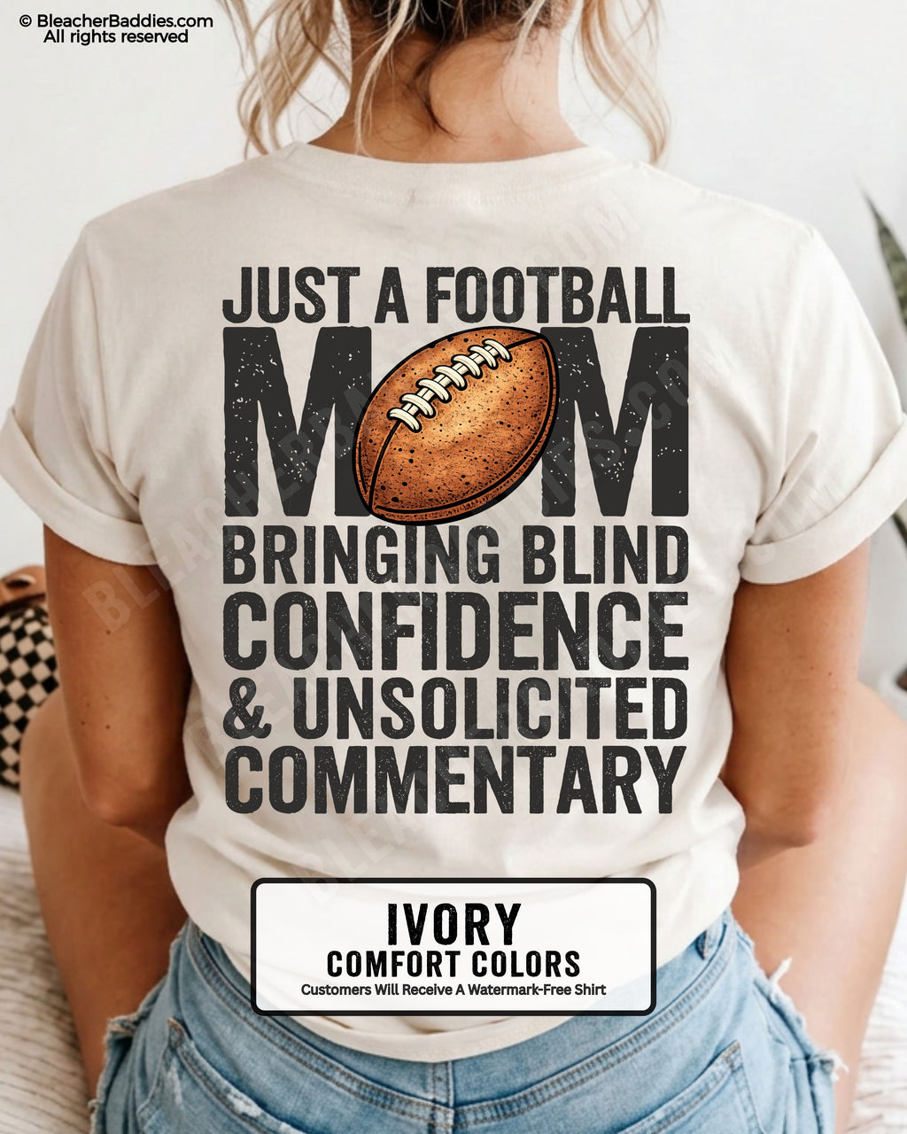 Ivory Comfort Colors t-shirt worn by woman showing back graphic reading “Just a football mom bringing blind confidence & unsolicited commentary” with football illustration