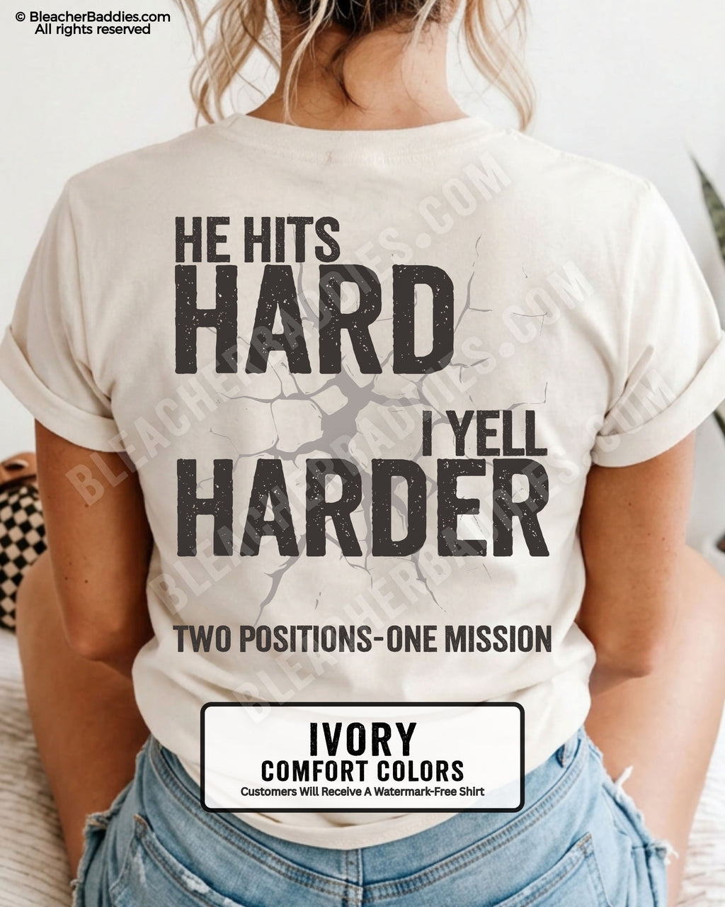 Back view of an ivory Comfort Colors t-shirt featuring the distressed "He Hits Hard I Yell Harder" football design with "Two Positions One Mission" printed across the lower back.