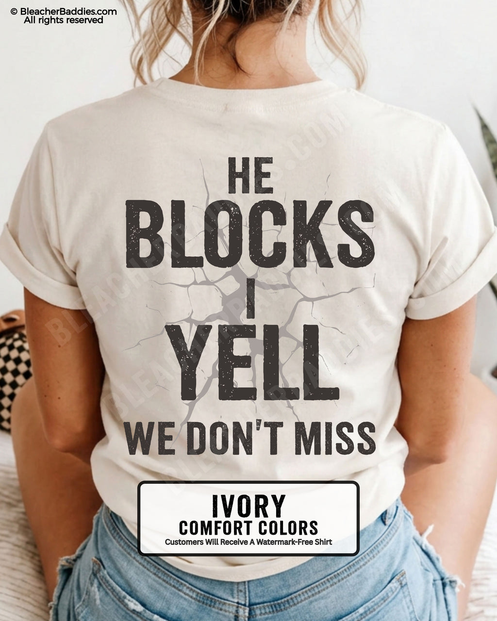 Woman wearing ivory Comfort Colors football mom game day shirt with back design that reads “He blocks I yell we don’t miss” in distressed black text with cracked graphic and ivory color label shown