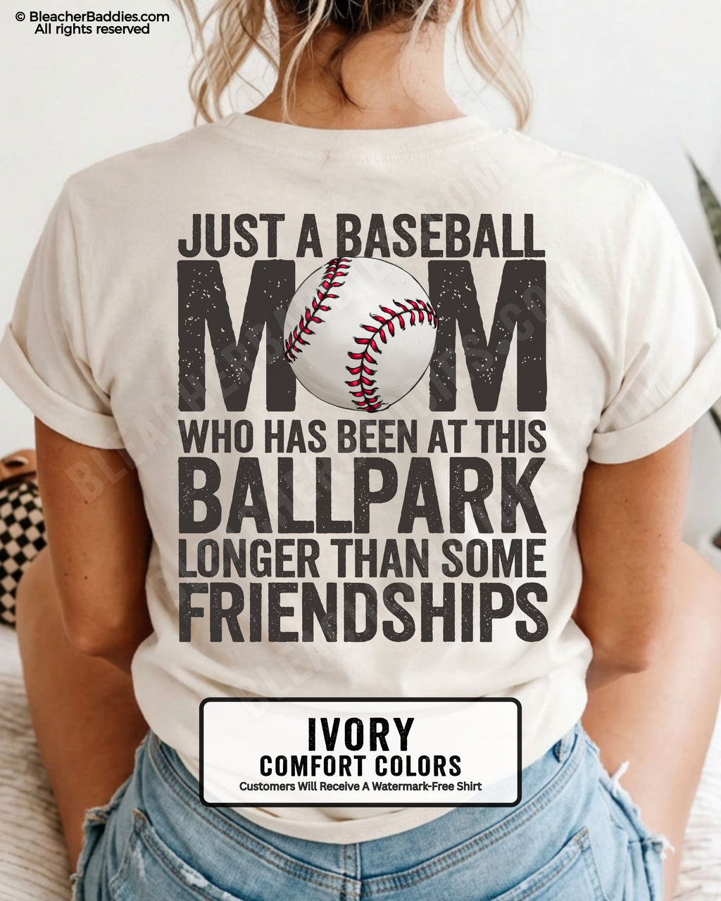 Ivory game day shirt worn by woman showing oversized distressed back graphic reading “Just a Baseball Mom Who Has Been at This Ballpark Longer Than Some Friendships” with baseball illustration over MOM text