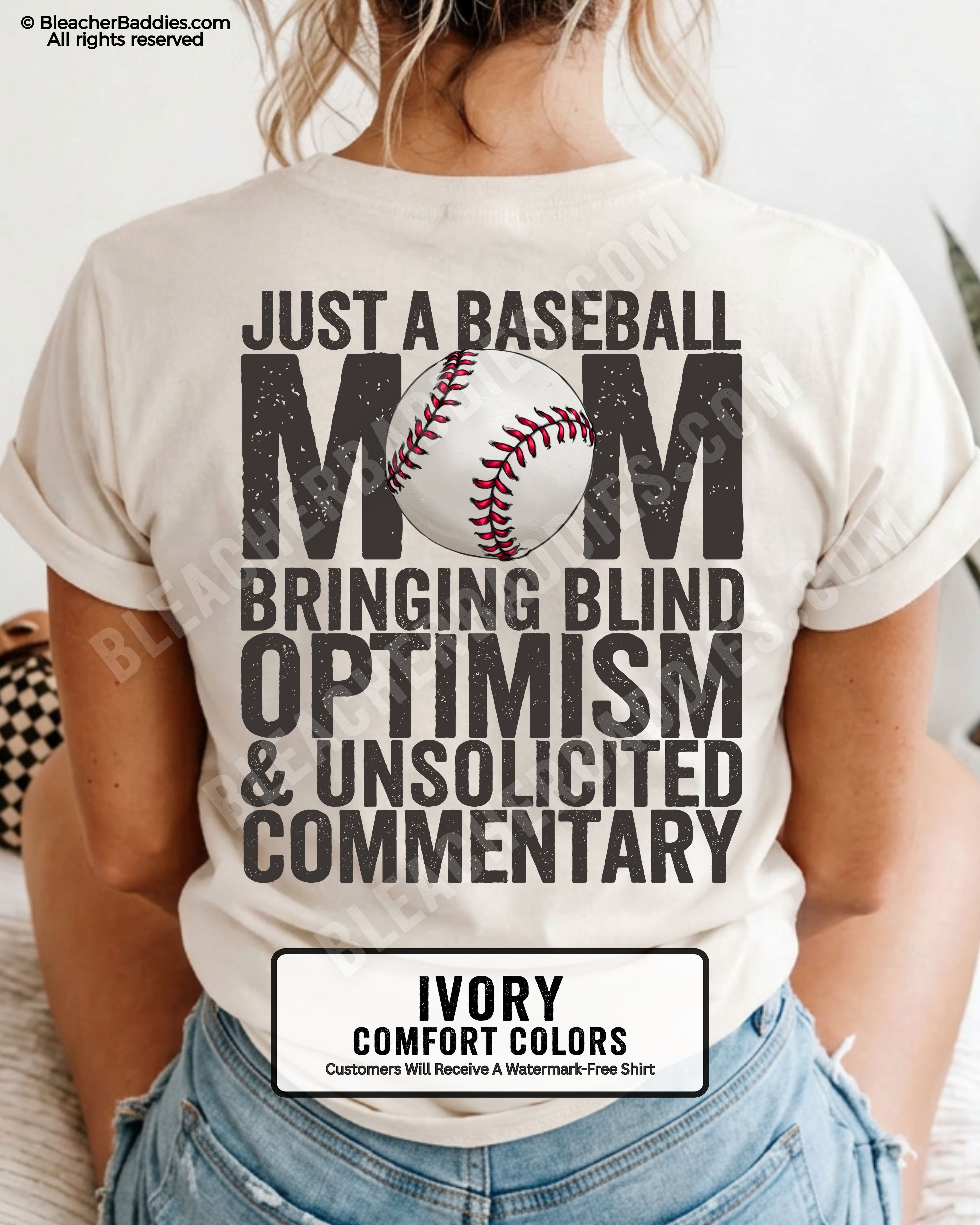 Ivory Comfort Colors game day shirt worn by woman showing distressed back graphic reading “Just a Baseball Mom Bringing Blind Optimism & Unsolicited Commentary” with baseball illustration over MOM text