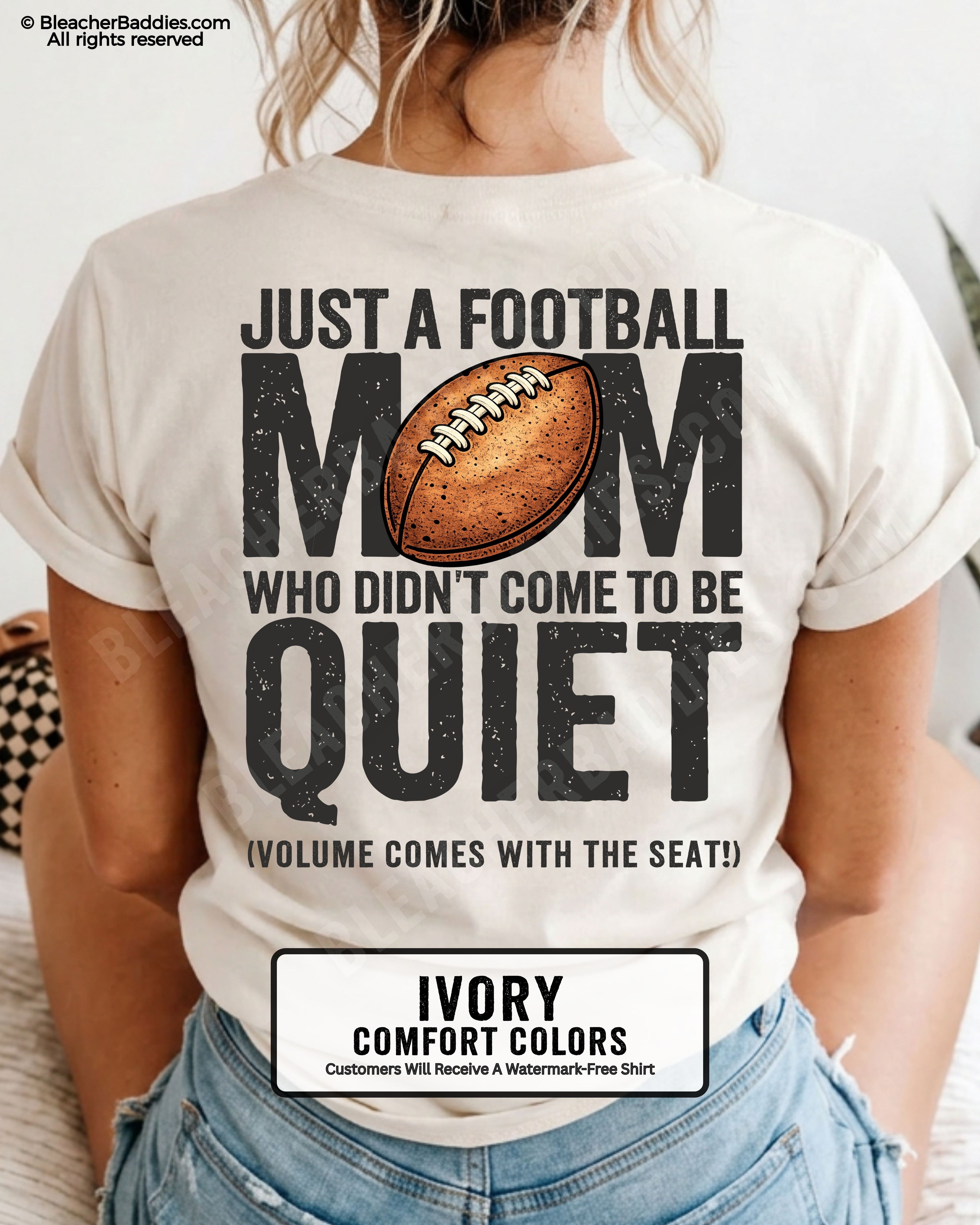 Football mom game day shirt on ivory Comfort Colors tee featuring bold back graphic that reads “Just a football mom who didn’t come to be quiet volume comes with the seat”