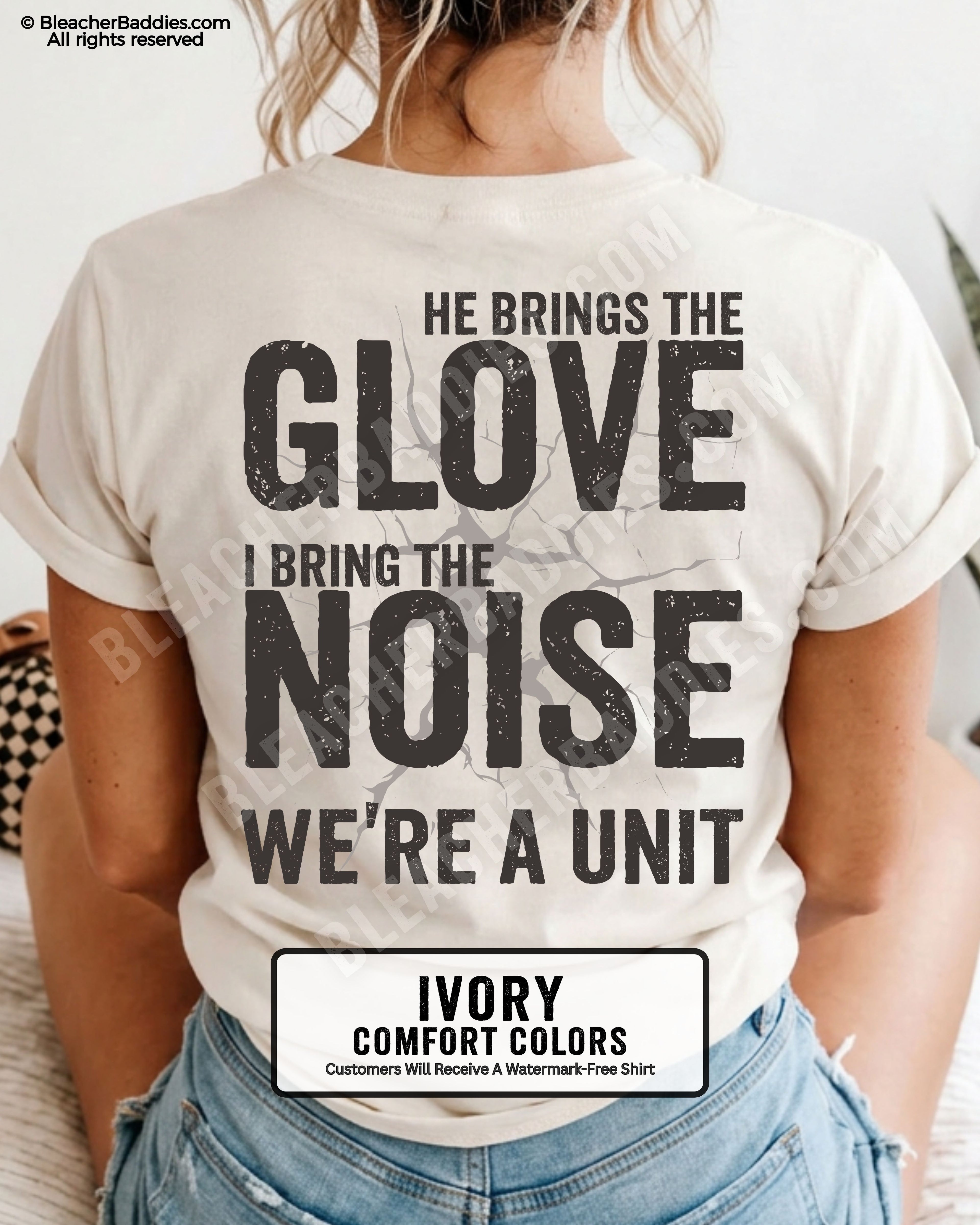 Ivory Comfort Colors baseball mom shirt featuring oversized distressed typography reading “He Brings The Glove I Bring The Noise We’re A Unit” with cracked vintage graphic detail and bold game day aesthetic.