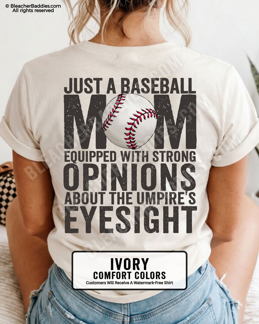 Ivory Comfort Colors game day shirt worn by woman showing distressed back graphic reading “Just a Baseball Mom Equipped With Strong Opinions About The Umpire’s Eyesight” with baseball illustration layered over MOM text