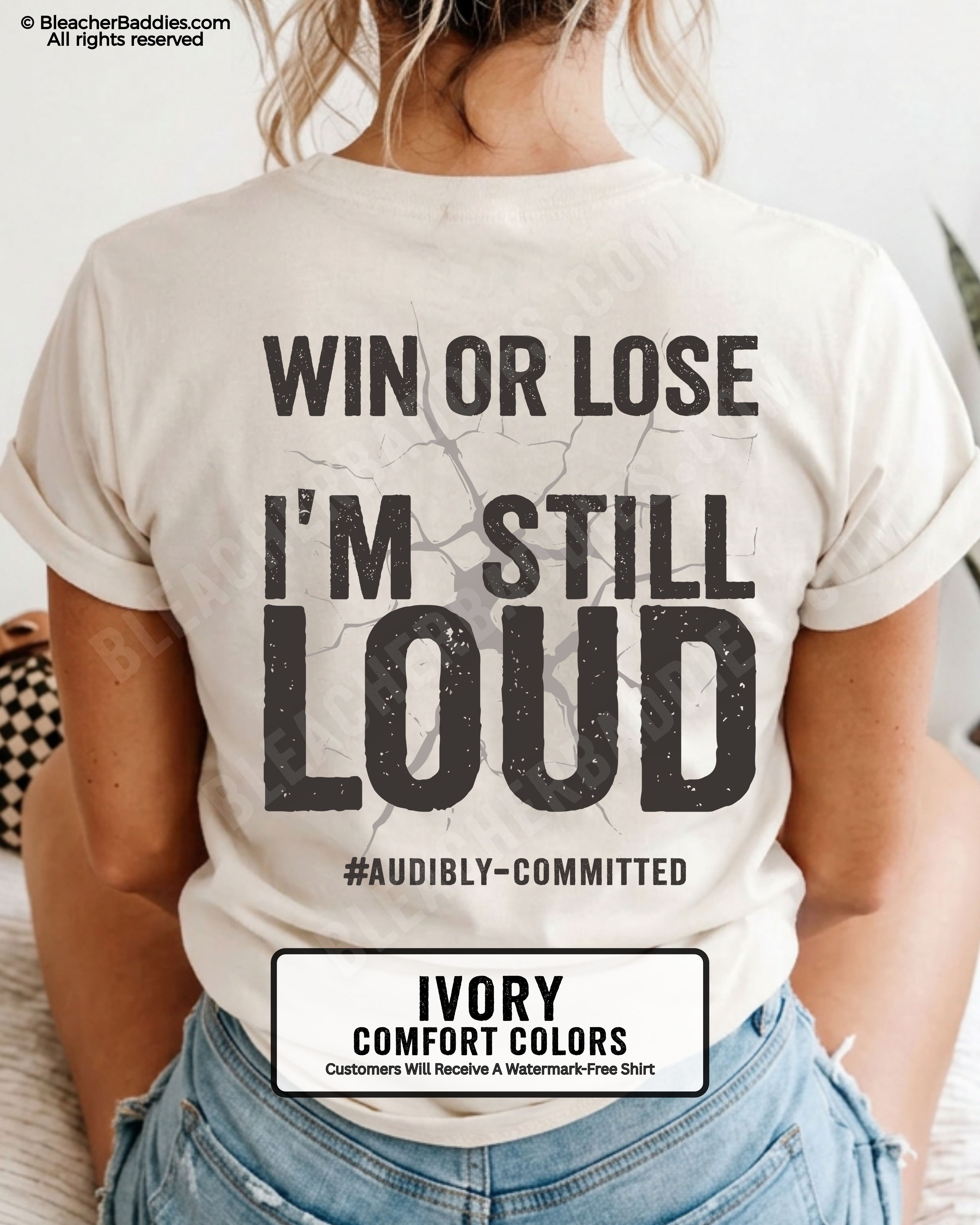 Woman wearing an ivory Comfort Colors t-shirt shown from the back featuring a large distressed black graphic that reads “Win or Lose I’m Still Loud #Audibly Committed.”