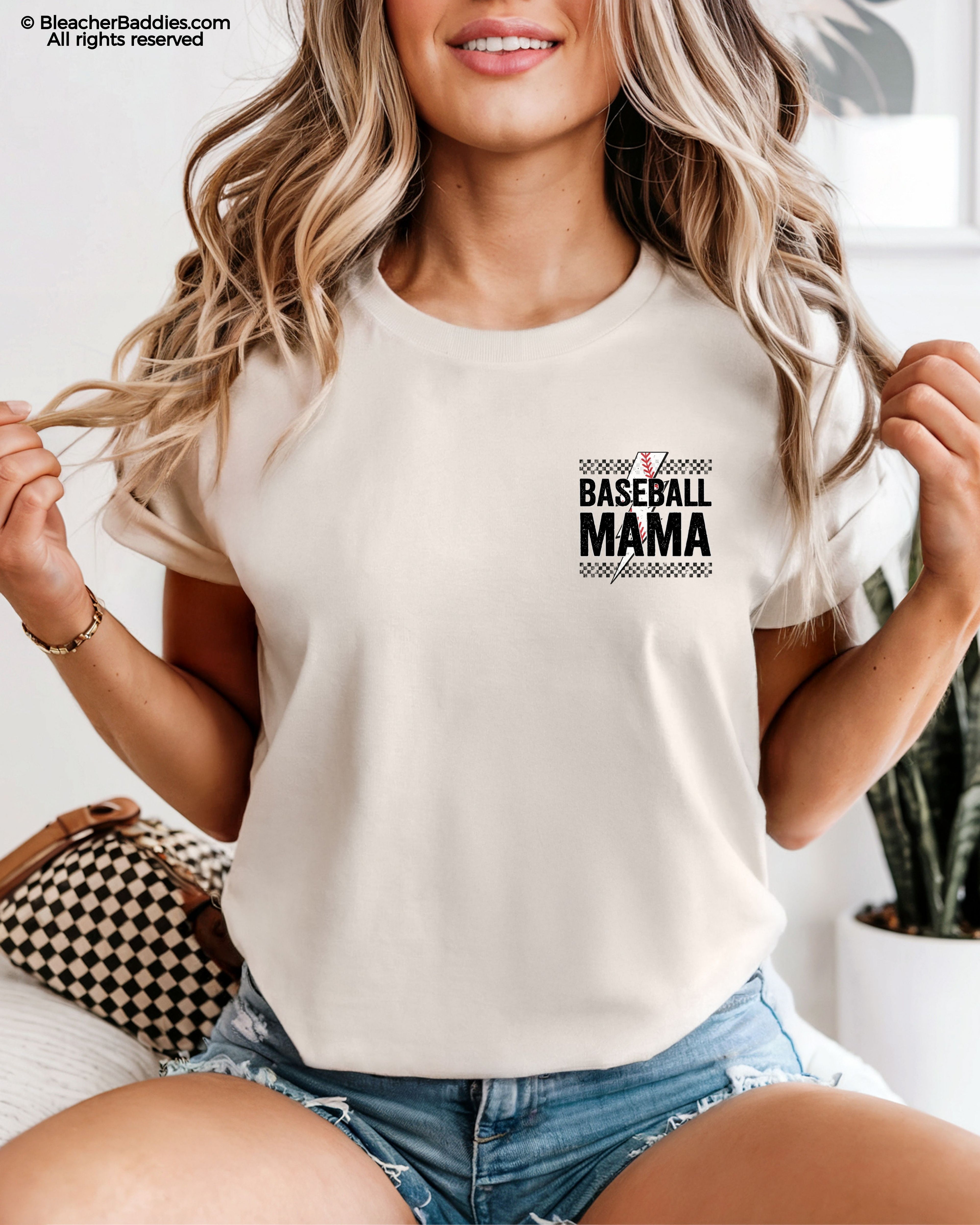 Ivory Comfort Colors baseball mom shirt with distressed black checkerboard stripes and a mini “Baseball Mama” graphic featuring red baseball stitching and bold grunge lettering on the chest pocket area.