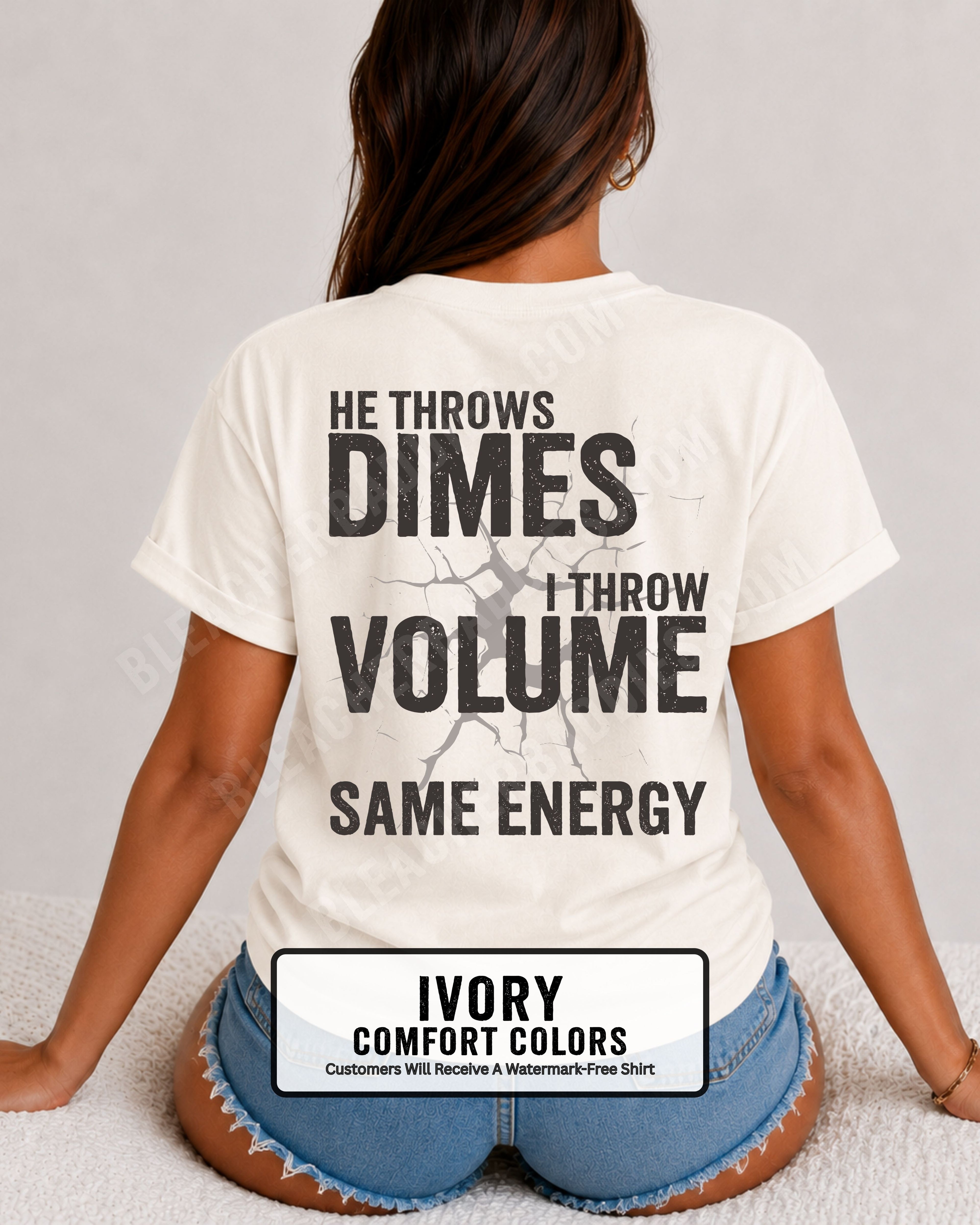 Back view of woman wearing ivory Comfort Colors t-shirt mockup showing large distressed text “He Throws Dimes I Throw Volume Same Energy” centered on the back design. Quarterback mom shirt. Football mom shirt.