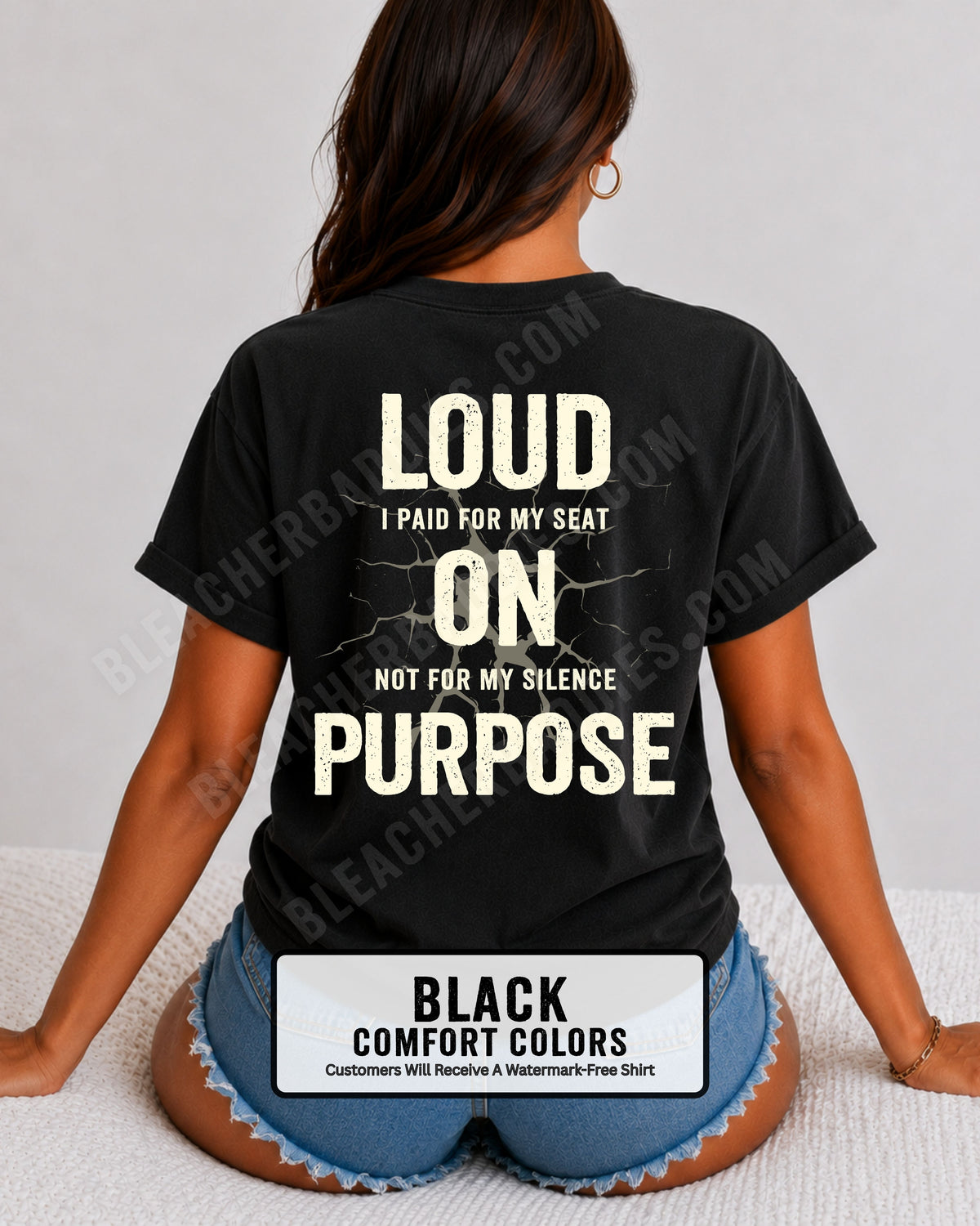 Woman wearing a black Comfort Colors t-shirt shown from the back featuring a large distressed cream graphic that reads “Loud I Paid for My Seat On Purpose Not For My Silence” with a cracked texture effect.