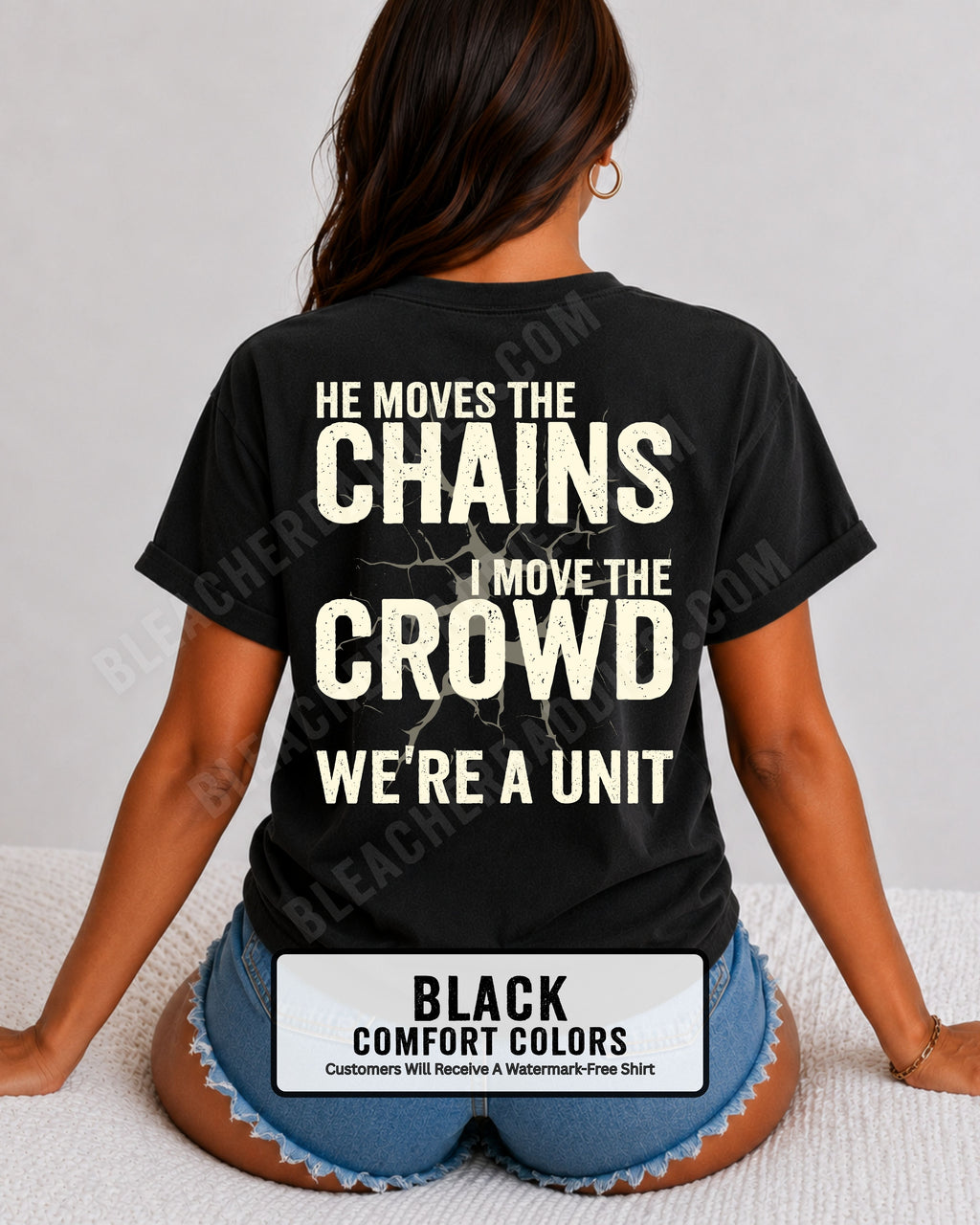 Back view of woman wearing black Comfort Colors football mom game day shirt featuring “He Moves the Chains I Move the Crowd We’re a Unit” bold graphic design