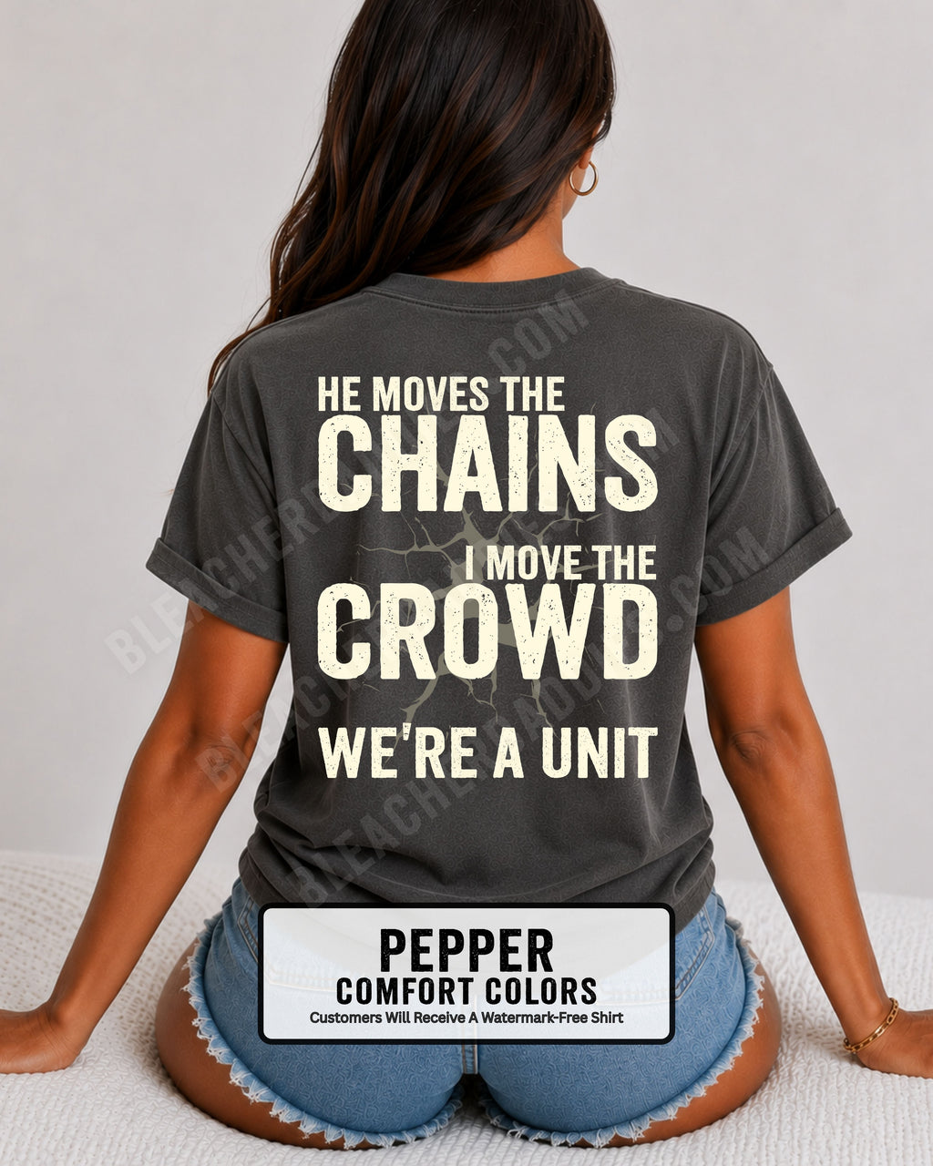 Back view of woman wearing pepper Comfort Colors football mom game day shirt featuring “He Moves the Chains I Move the Crowd We’re a Unit” bold graphic design
