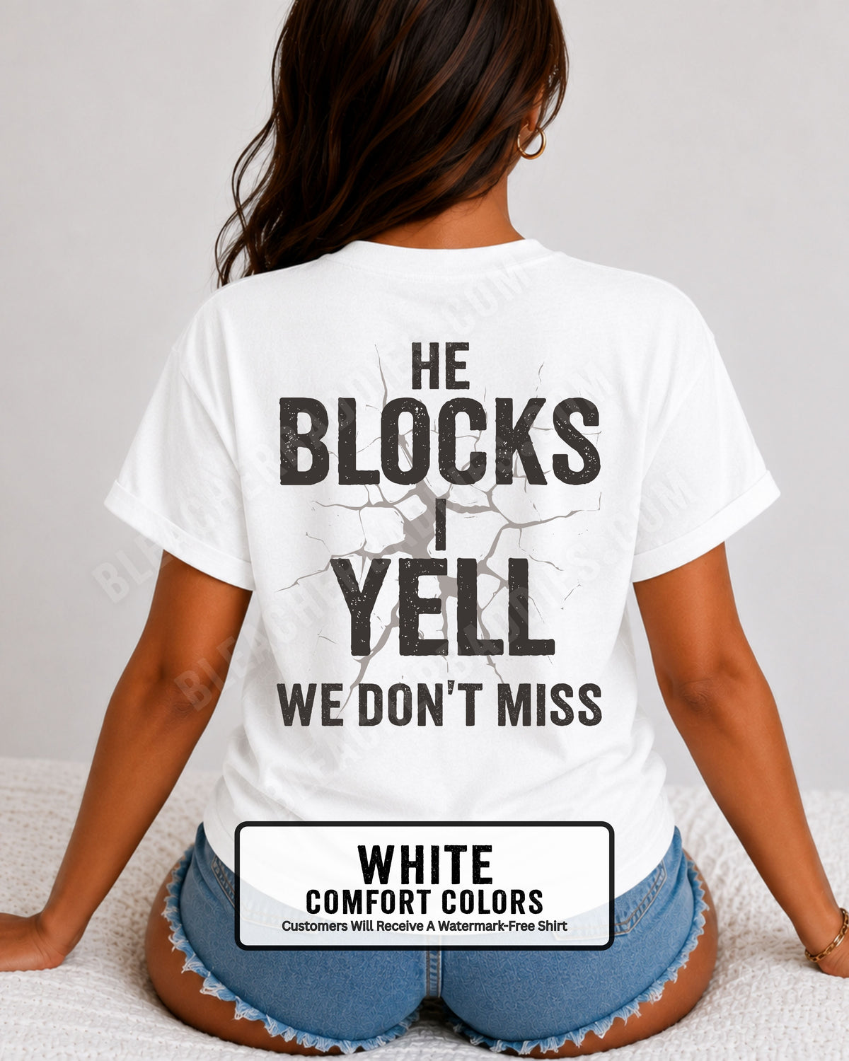 Woman wearing WHITE Comfort Colors football mom game day shirt with back design that reads “He blocks I yell we don’t miss” in distressed black text with cracked graphic