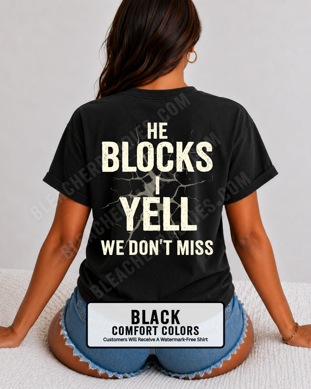 Woman wearing black Comfort Colors football mom game day shirt with back design that reads “He blocks I yell we don’t miss” in distressed black text with cracked graphic 