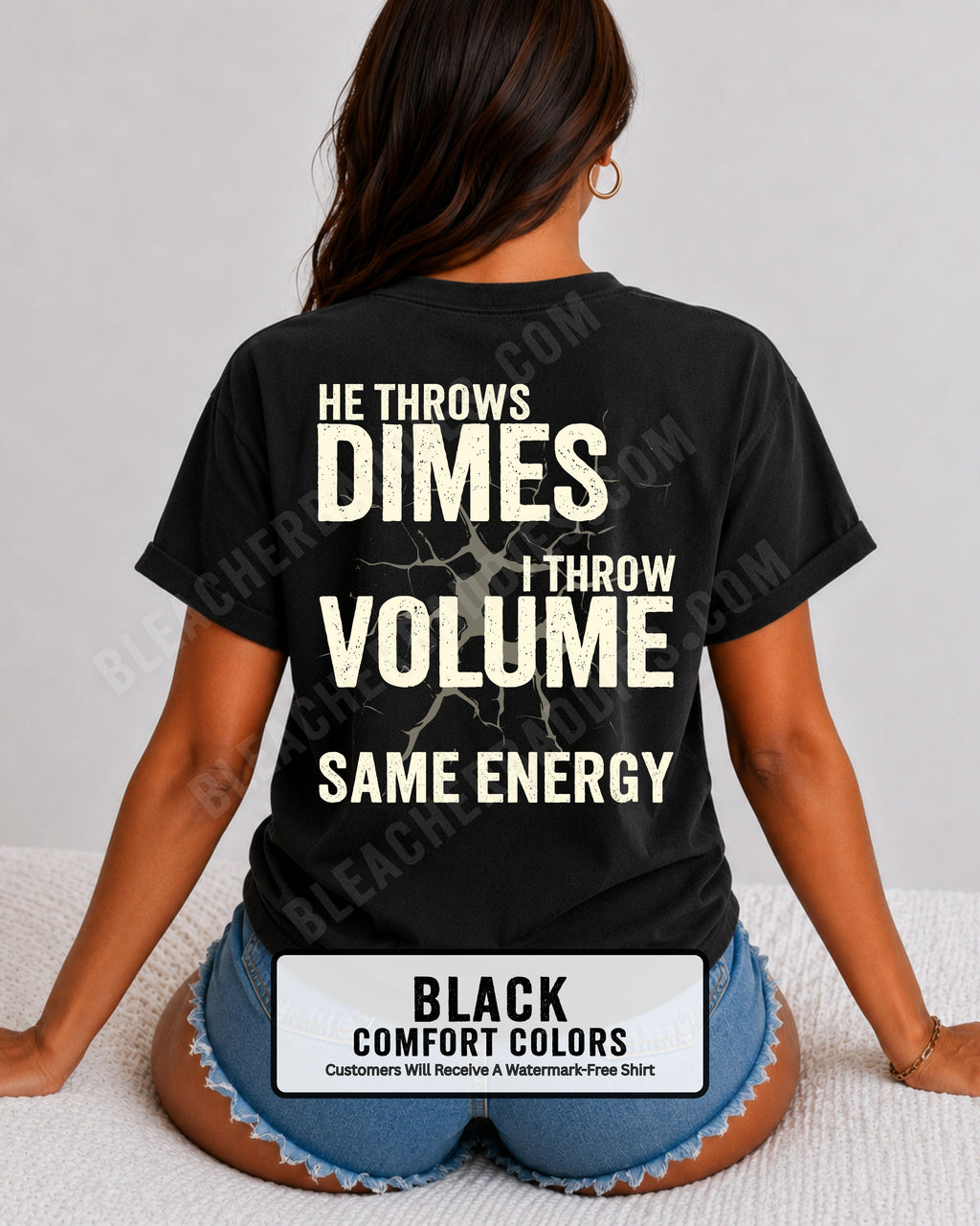 Back view of woman wearing black Comfort Colors t-shirt mockup showing large distressed text “He Throws Dimes I Throw Volume Same Energy” centered on the back design. Quarterback mom shirt. Football mom shirt.