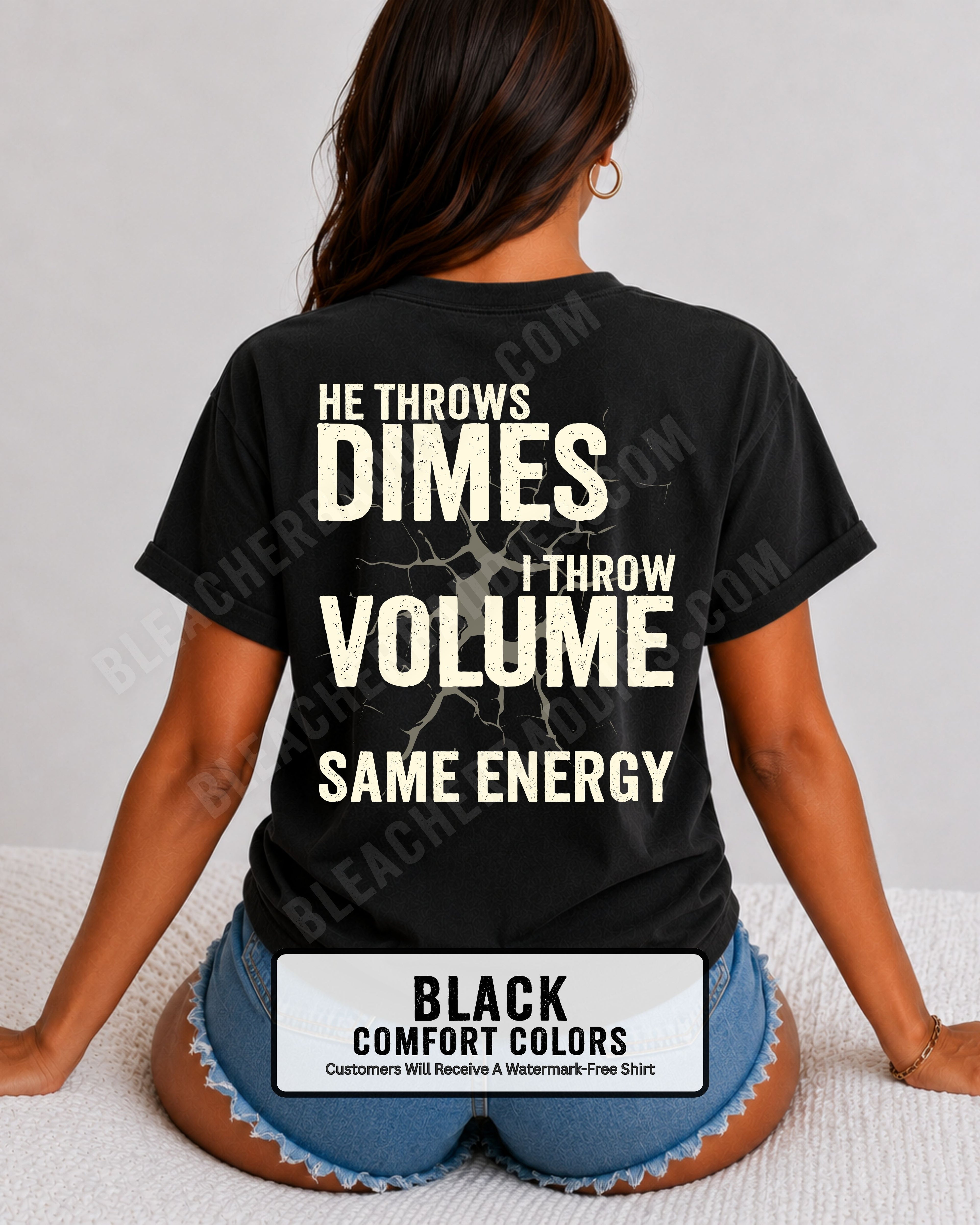 Back view of woman wearing black Comfort Colors t-shirt mockup showing large distressed text “He Throws Dimes I Throw Volume Same Energy” centered on the back design. Quarterback mom shirt. Football mom shirt.