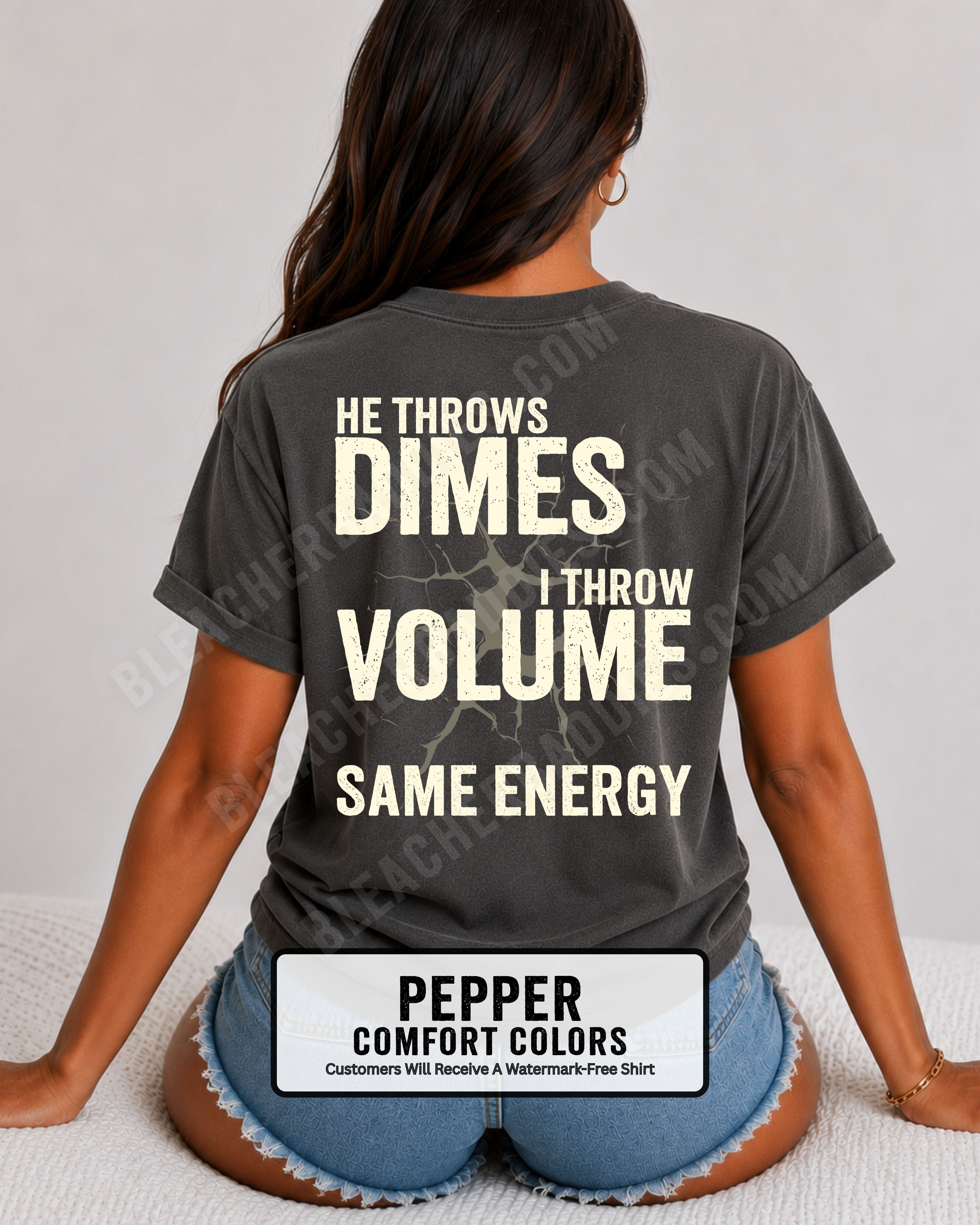 Back view of woman wearing pepper Comfort Colors t-shirt mockup showing large distressed text “He Throws Dimes I Throw Volume Same Energy” centered on the back design. Quarterback mom shirt. Football mom shirt.