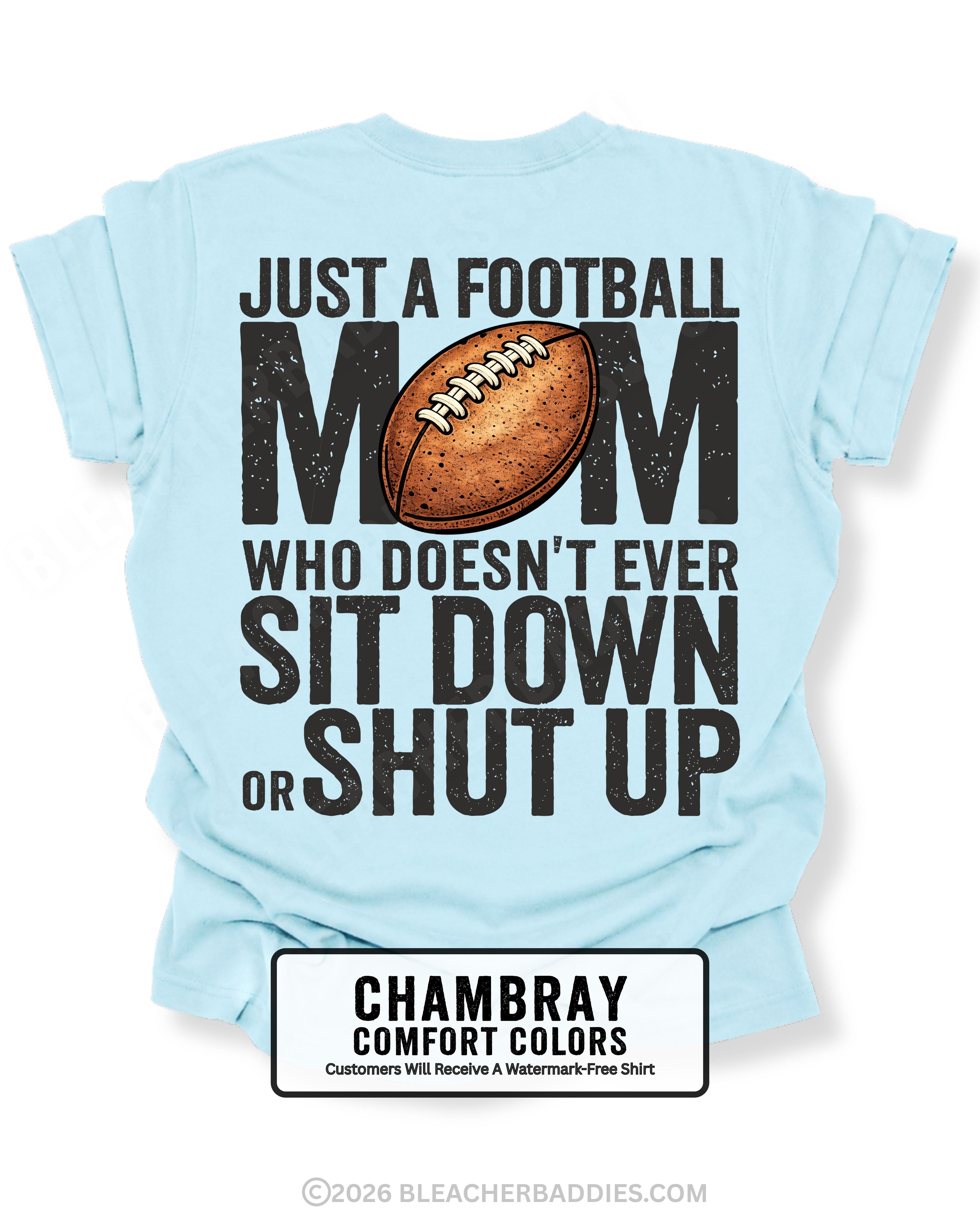 Chambray Comfort Colors t-shirt shown from back with oversized graphic text “Just a Football Mom Who Doesn’t Ever Sit Down or Shut Up” and football illustration