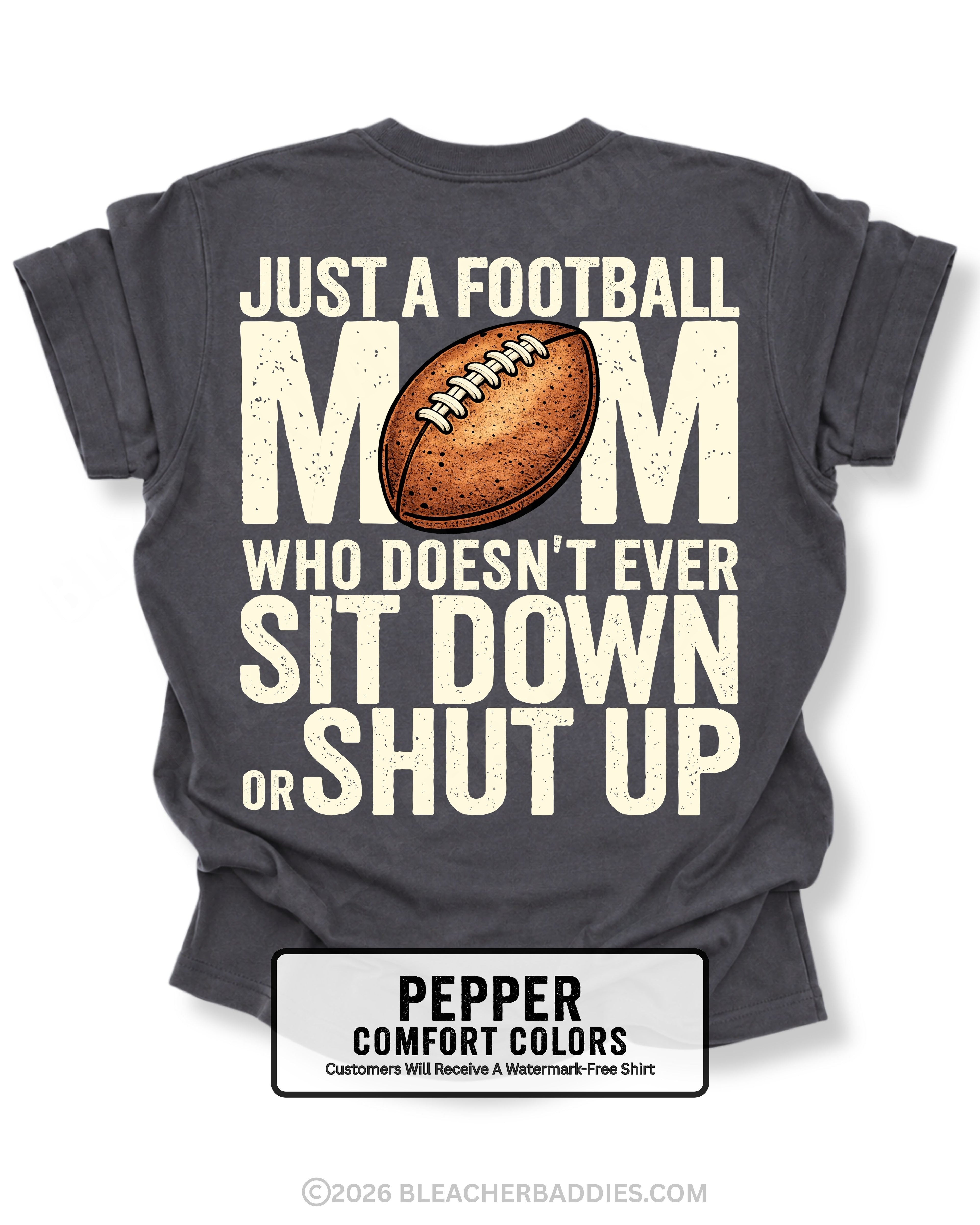 Pepper Comfort Colors t-shirt shown from back with oversized graphic text “Just a Football Mom Who Doesn’t Ever Sit Down or Shut Up” and football illustration
