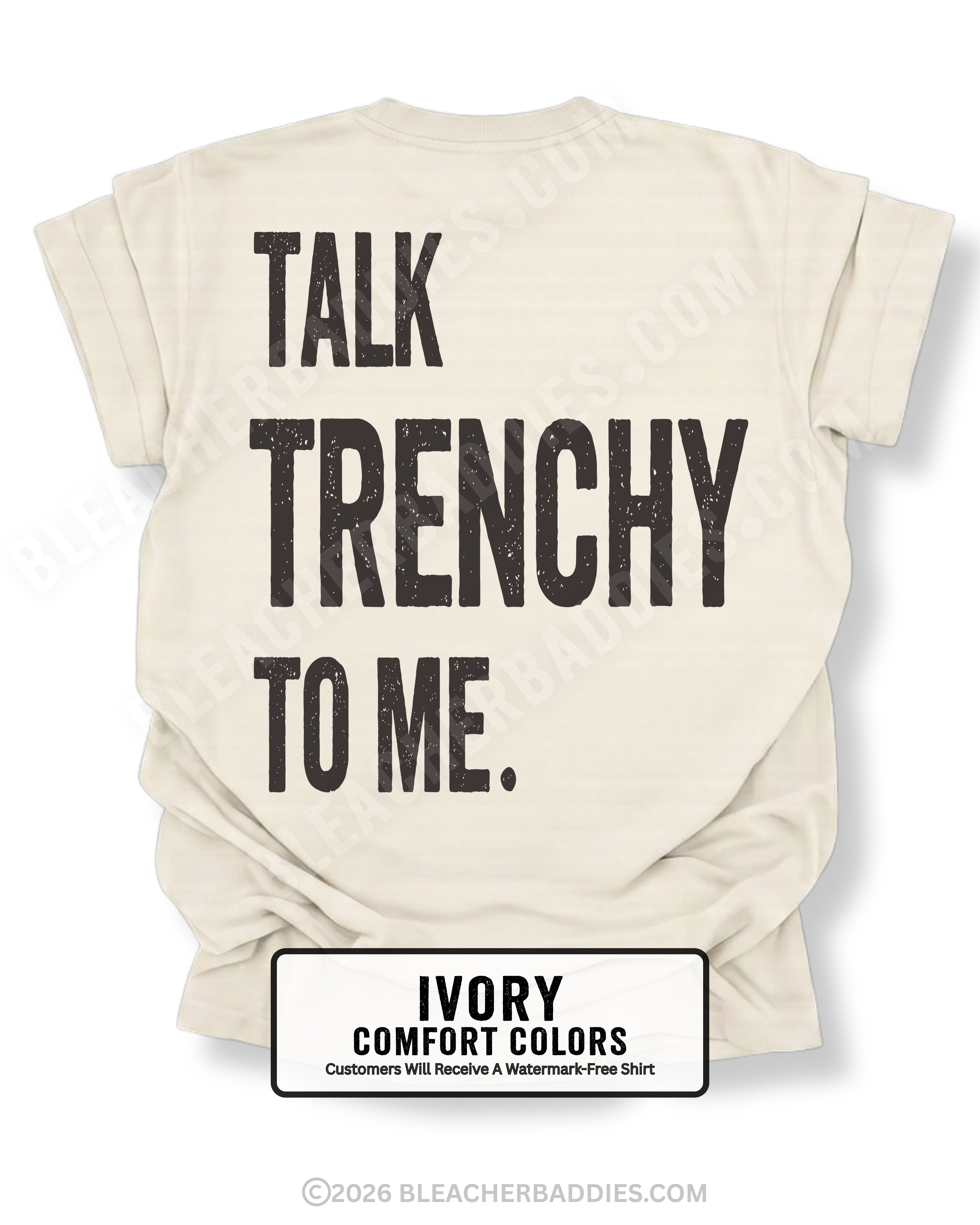 Ivory Comfort Colors T-shirt featuring the funny football back design "Talk Trenchy to Me" in distressed black lettering. Flat lay mockup showcasing a humorous offensive line fan shirt perfect for football moms, dads, tailgates, Friday night lights, and game day.
