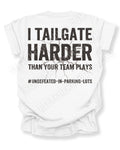 White Comfort Colors football mom game day shirt flat lay with back design that reads “I tailgate harder than your team plays #undefeated-in-parking-lots” in distressed black text with cracked graphic. Football mom shirt. Tailgating football fan shirt.