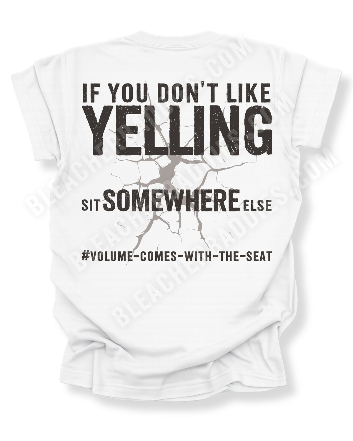 White t-shirt shown from the back featuring a large distressed black graphic that reads “If You Don’t Like Yelling Sit Somewhere Else #Volume Comes With the Seat” with a cracked texture effect. Football mom shirt. Lineman mom shirt. Running back mom shirt. Quarterback mom shirt Linebacker mom shirt.
