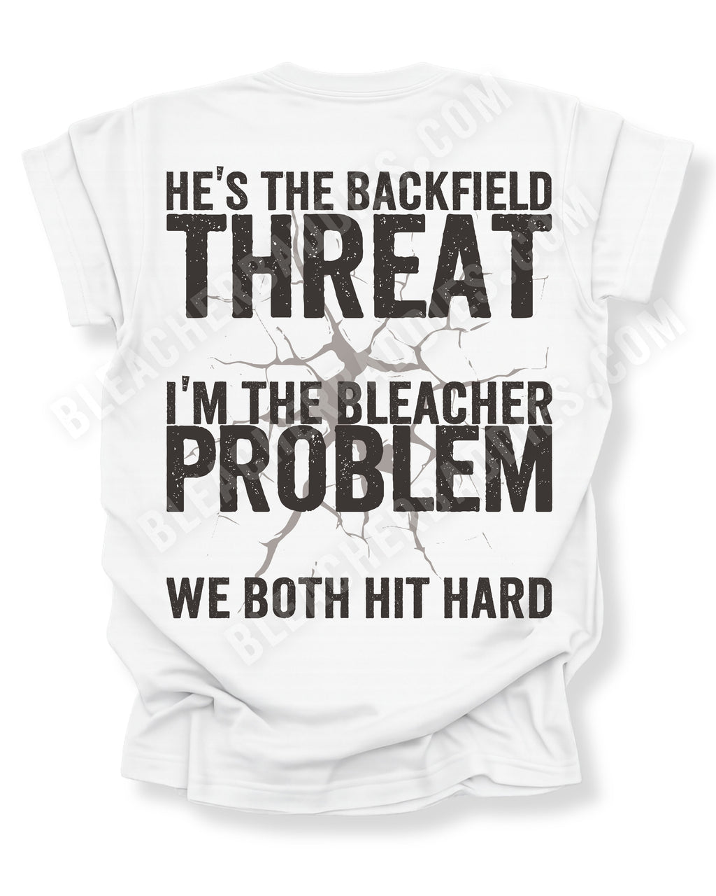 Back view of white Comfort Colors football mom game day shirt featuring “He’s the Backfield Threat I’m the Bleacher Problem We Both Hit Hard” bold graphic design. Linebacker mom shirt. Defensive Lineman Mom Shirt. Football mom shirt.