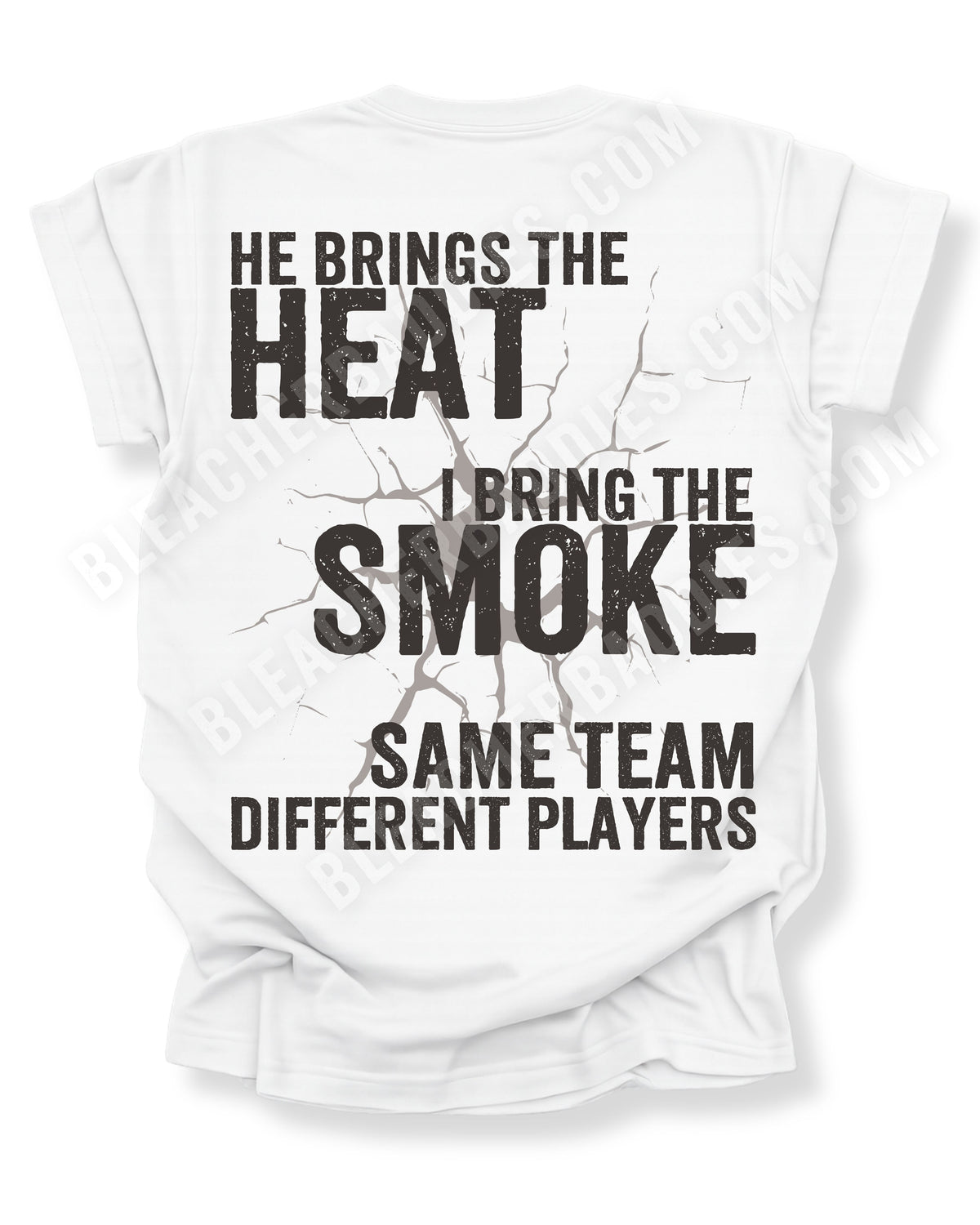 Back of white comfort colors t-shirt with bold distressed text “He Brings the Heat I Bring the Smoke Same Team Different Players” and cracked graphic detail. Football Mom Shirt.