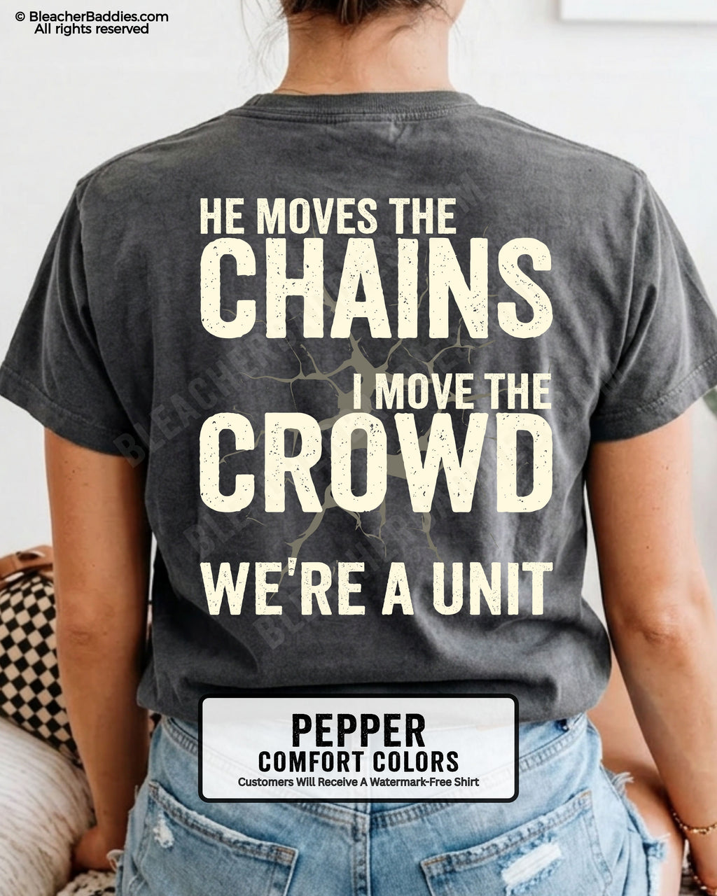 Back view of woman wearing PEPPER Comfort Colors football mom game day shirt featuring “He Moves the Chains I Move the Crowd We’re a Unit” bold graphic design