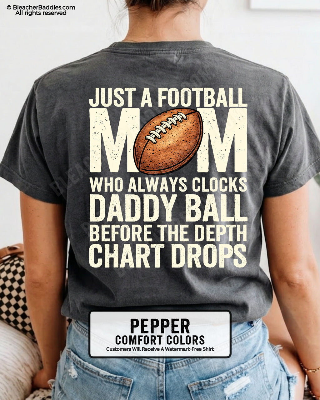 Pepper Comfort Colors t-shirt worn by woman showing back graphic reading “Just a football mom who always clocks daddy ball before the depth chart drops” with football illustration