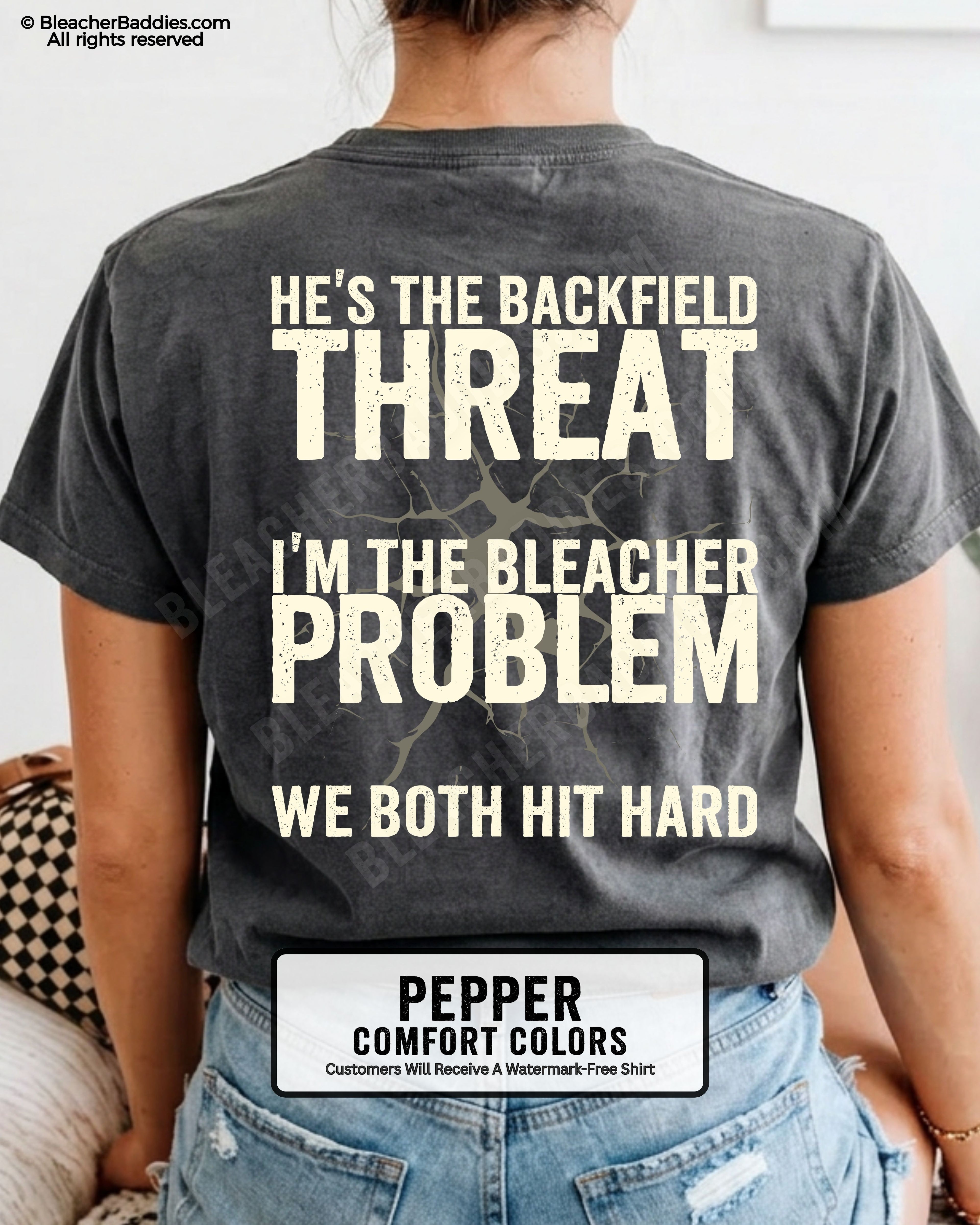 Back view of football mom wearing PEPPER Comfort Colors game day shirt with “He’s the Backfield Threat I’m the Bleacher Problem We Both Hit Hard” graphic design