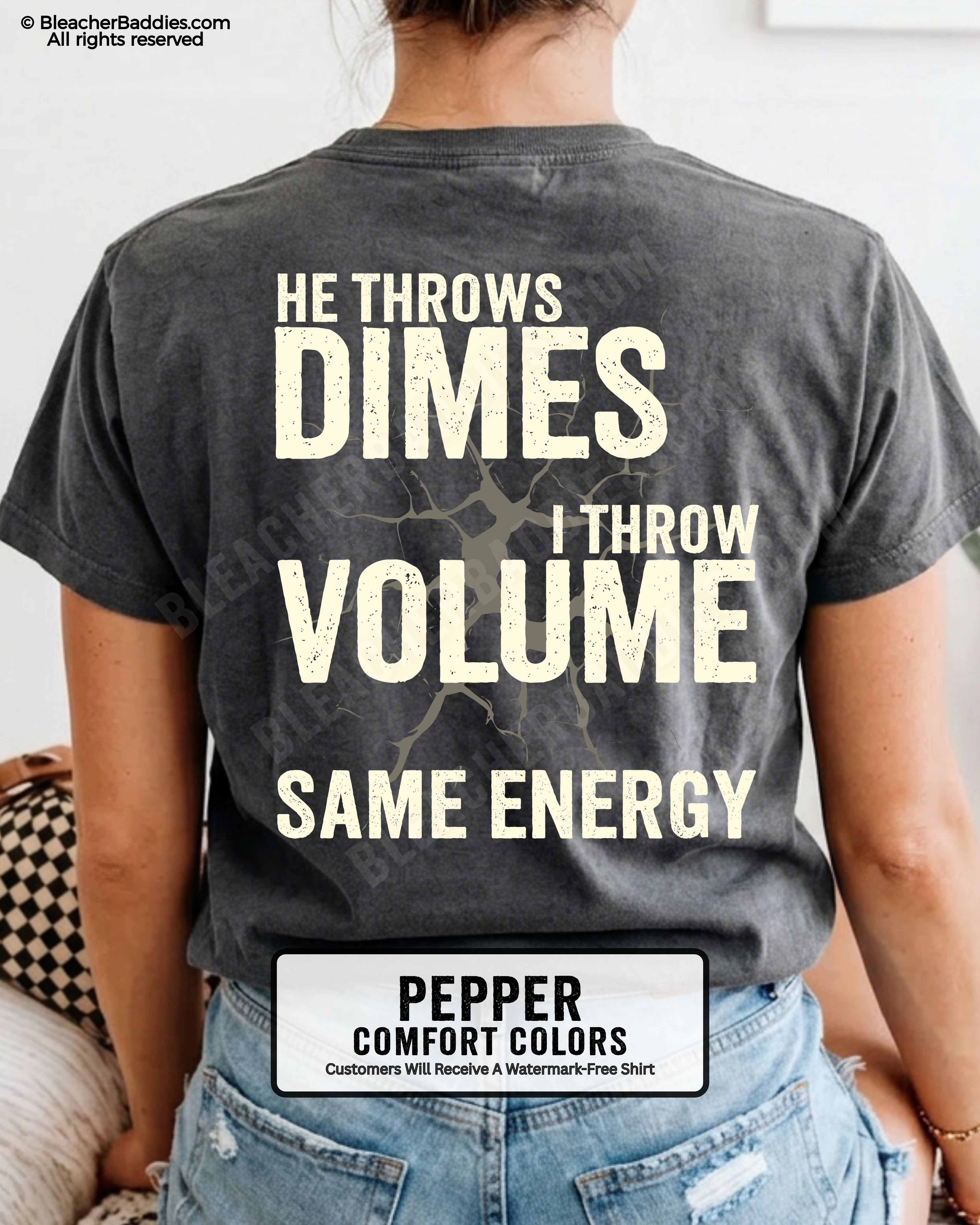 Back view of woman wearing pepper Comfort Colors t-shirt mockup showing large distressed text “He Throws Dimes I Throw Volume Same Energy” centered on the back design