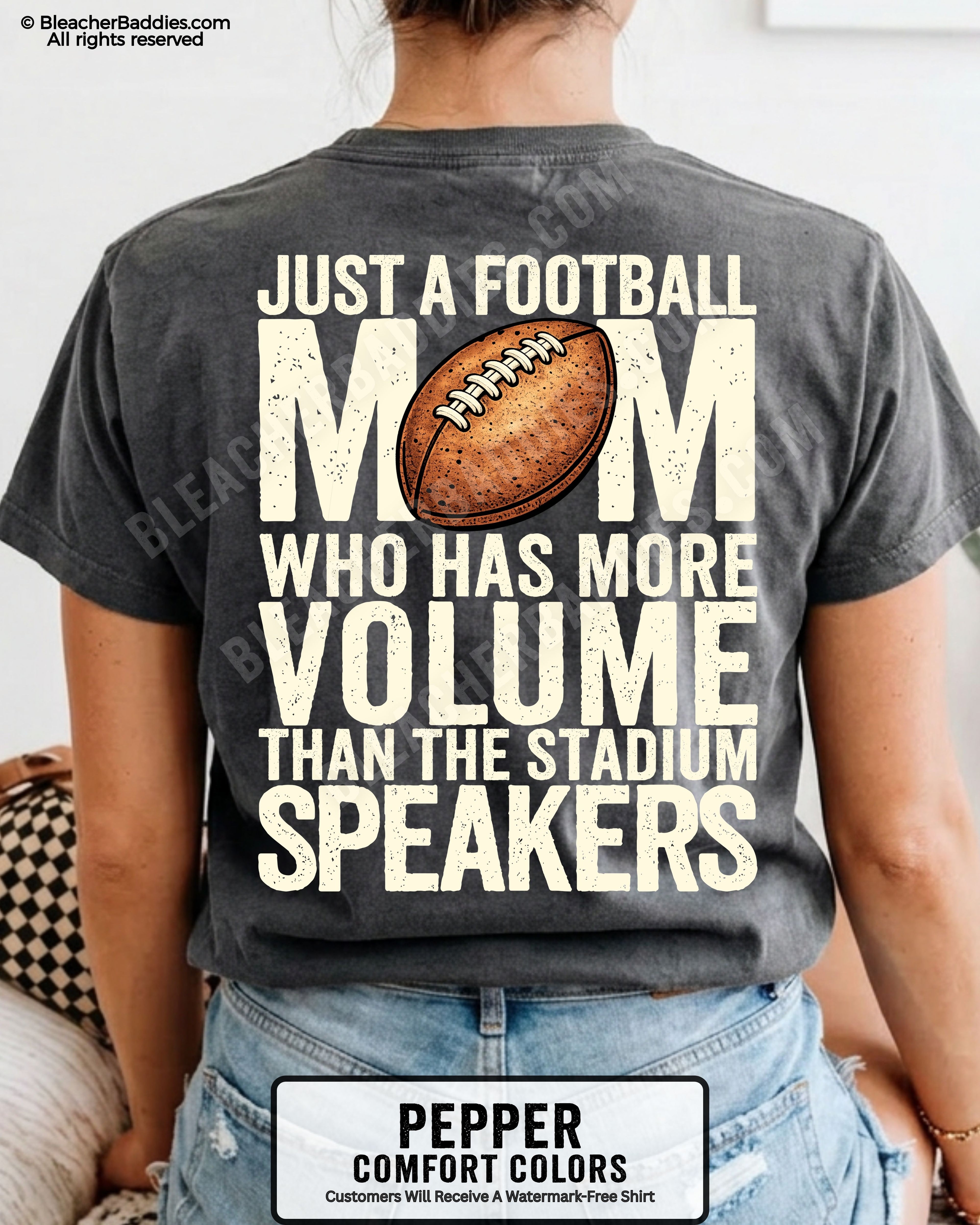 Pepper Comfort Colors t-shirt worn by woman showing back graphic reading “Just a football mom who has more volume than the stadium speakers” with football illustration