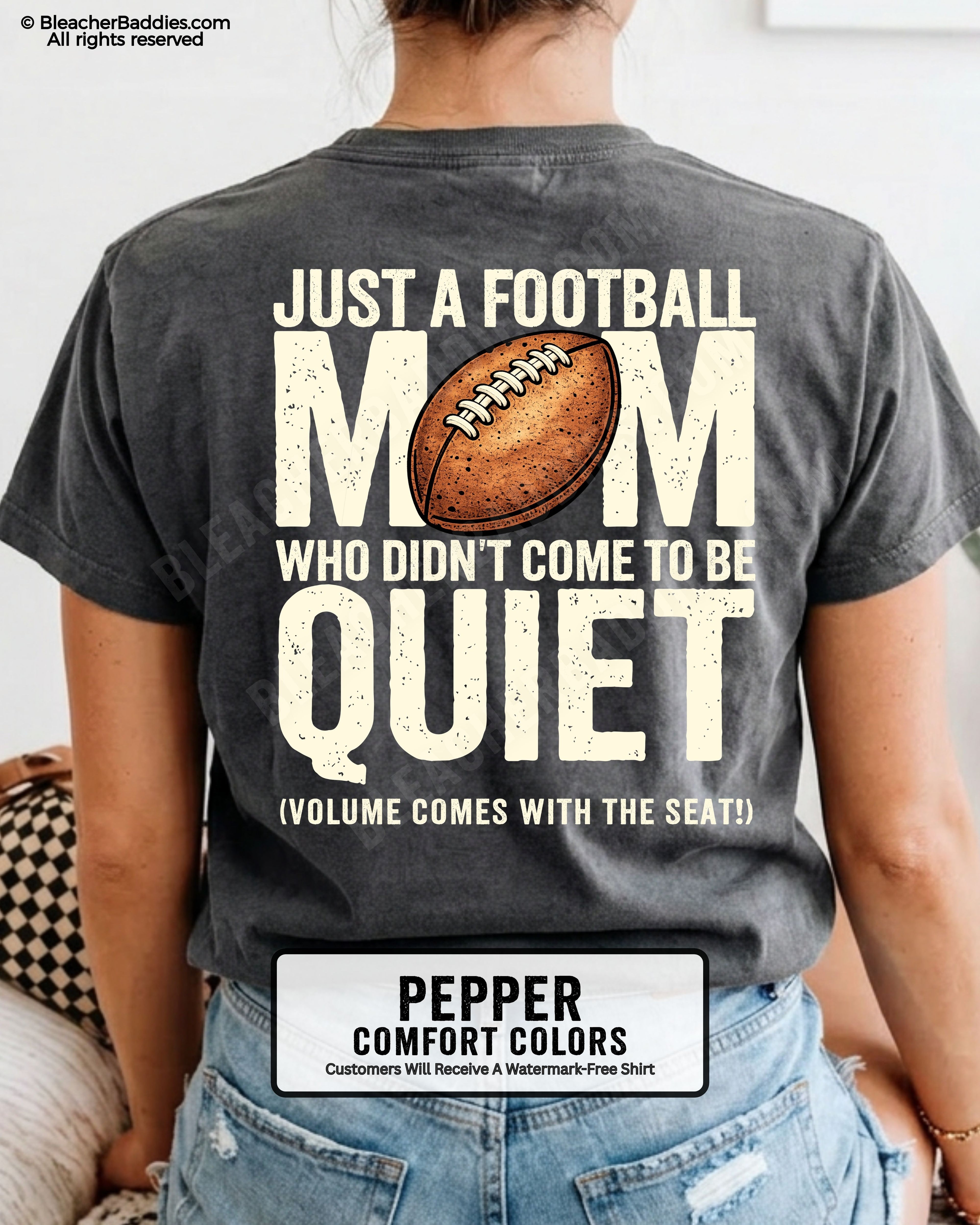 Football mom game day shirt on pepper Comfort Colors tee featuring bold back graphic that reads “Just a football mom who didn’t come to be quiet volume comes with the seat”
