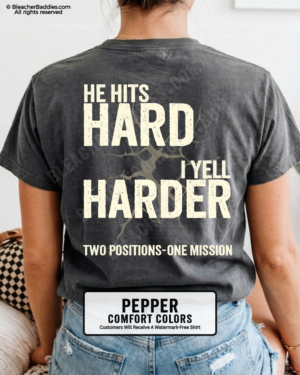 Back view of a pepper Comfort Colors t-shirt featuring the distressed "He Hits Hard I Yell Harder" football design with "Two Positions One Mission" printed across the lower back.