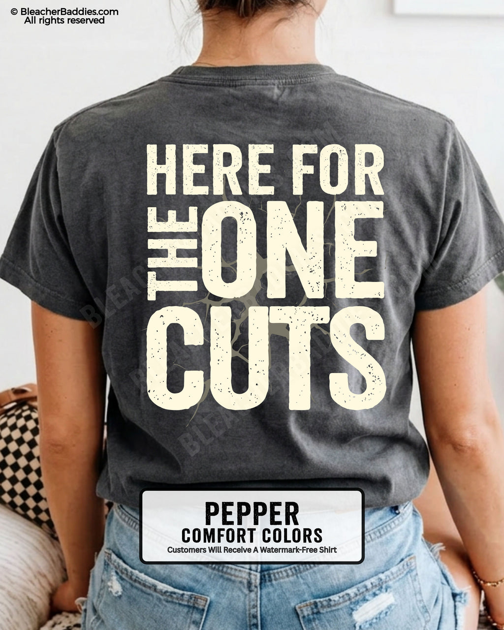 close-up back view of pepper comfort colors football mom game day shirt with “here for the one cuts” design printed on the back