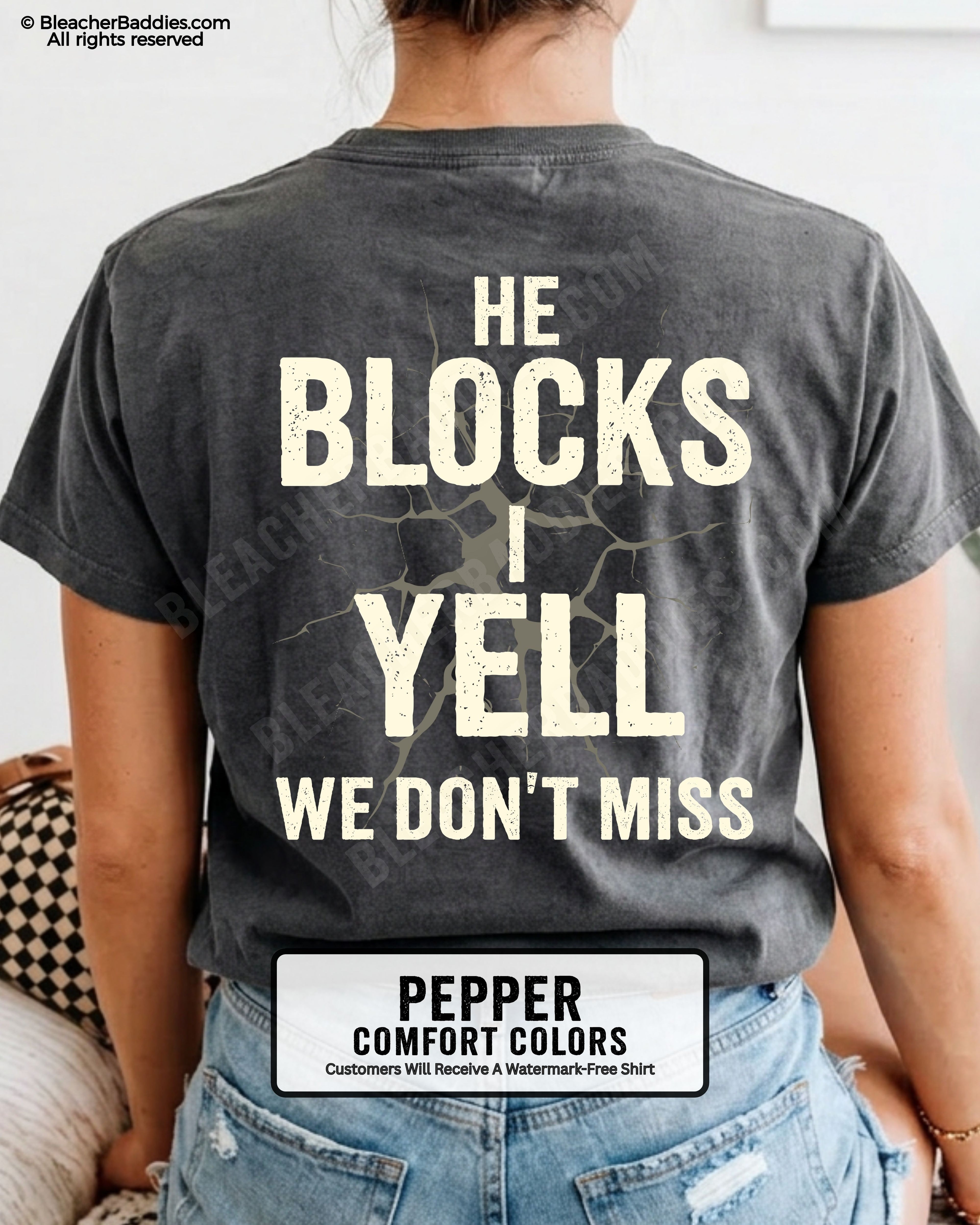 Woman wearing PEPPER Comfort Colors football mom game day shirt with back design that reads “He blocks I yell we don’t miss” in distressed CREAM text with cracked graphic and ivory color label shown