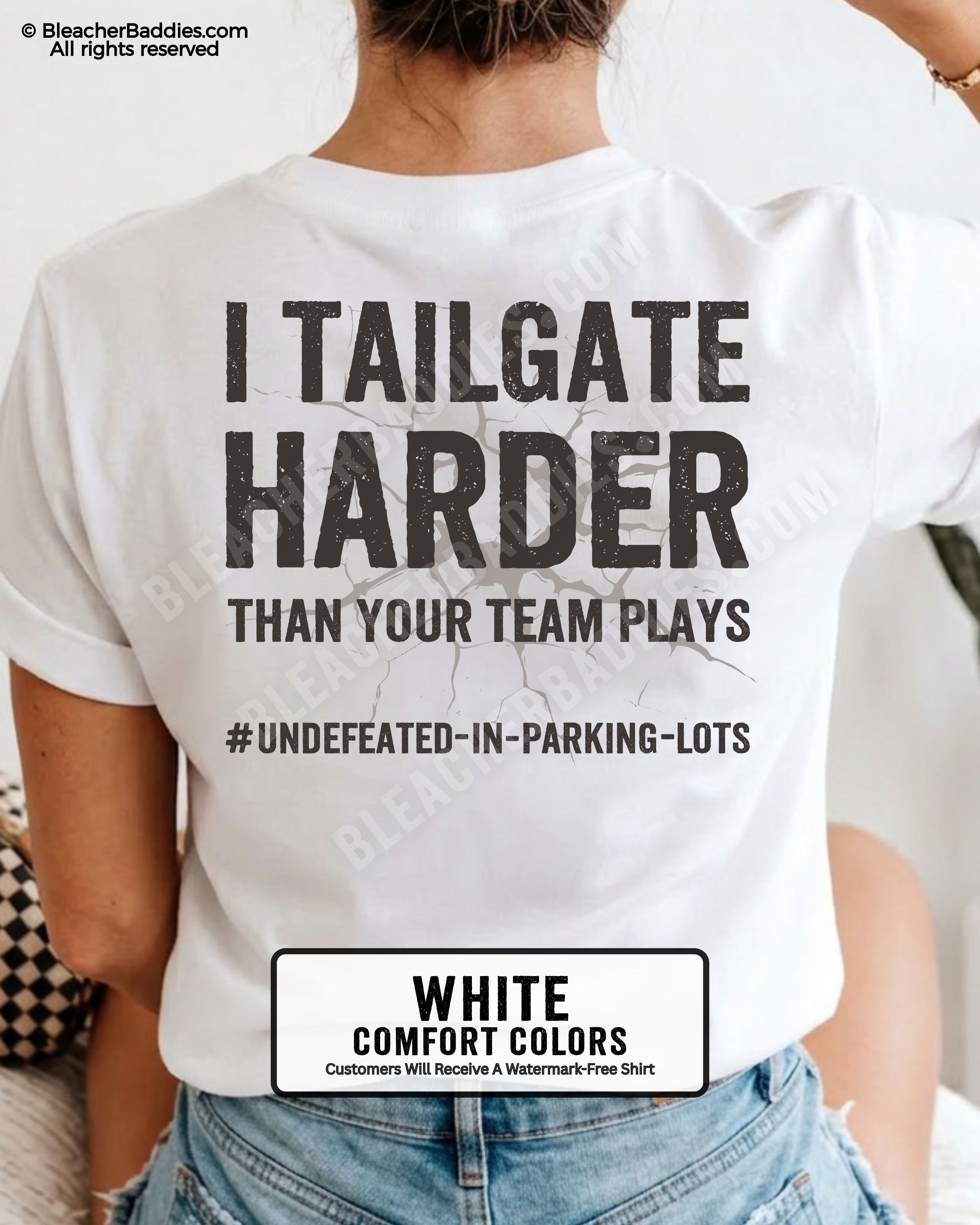 White Comfort Colors baseball mom graphic tee with distressed oversized lettering reading “I Tailgate Harder Than Your Team Plays” with hashtag “#Undefeated-In-Parking-Lots” across the back