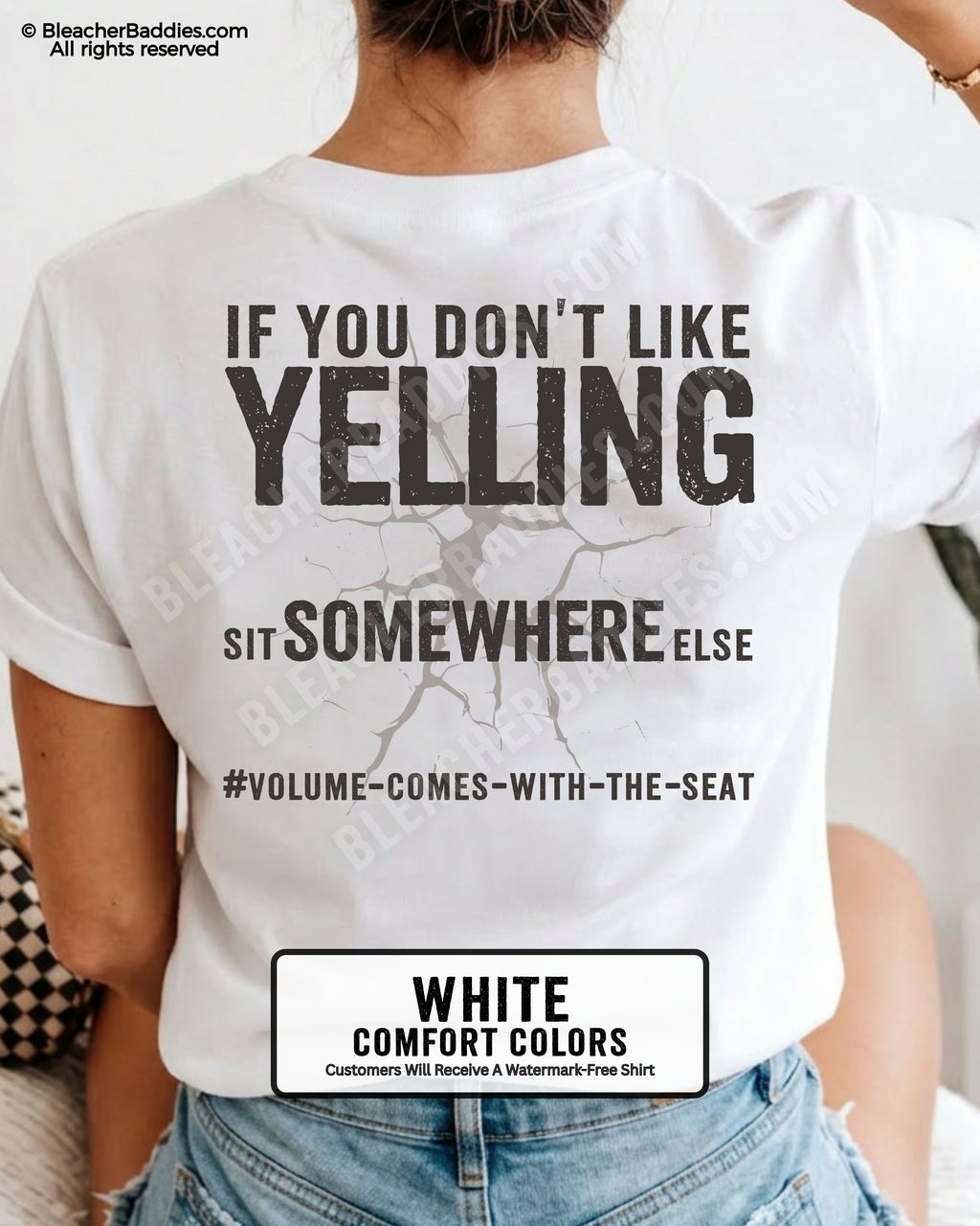 Woman wearing white Comfort Colors shirt with distressed text reading “If You Don’t Like Yelling Sit Somewhere Else” and “#Volume-Comes-With-The-Seat” underneath.