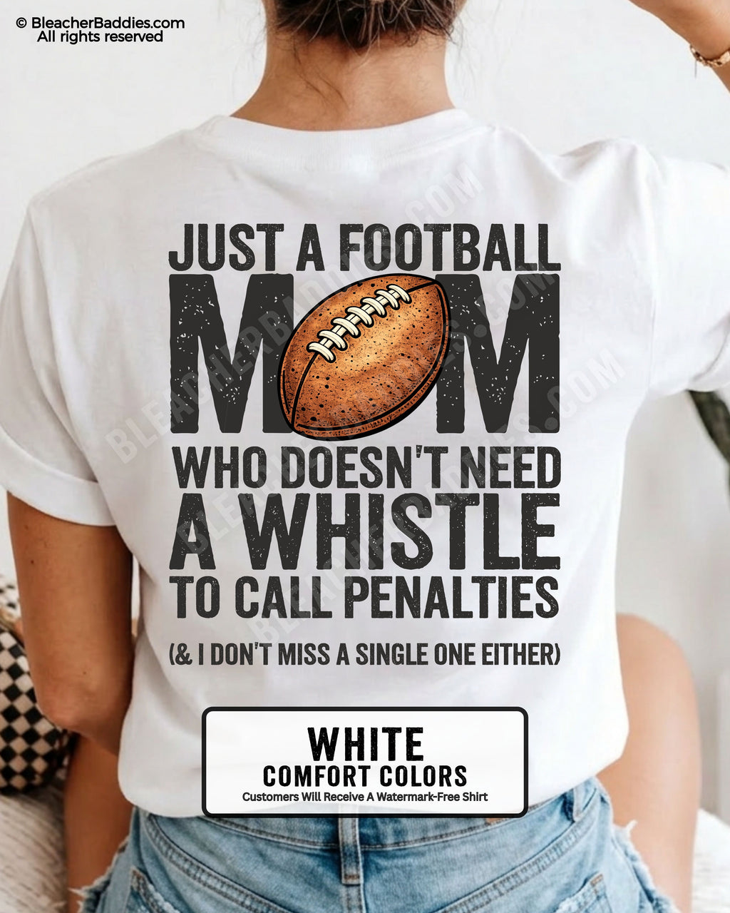 Football mom game day shirt on white Comfort Colors tee with bold back graphic that reads “Just a football mom who doesn’t need a whistle to call penalties and I don’t miss a single one either”