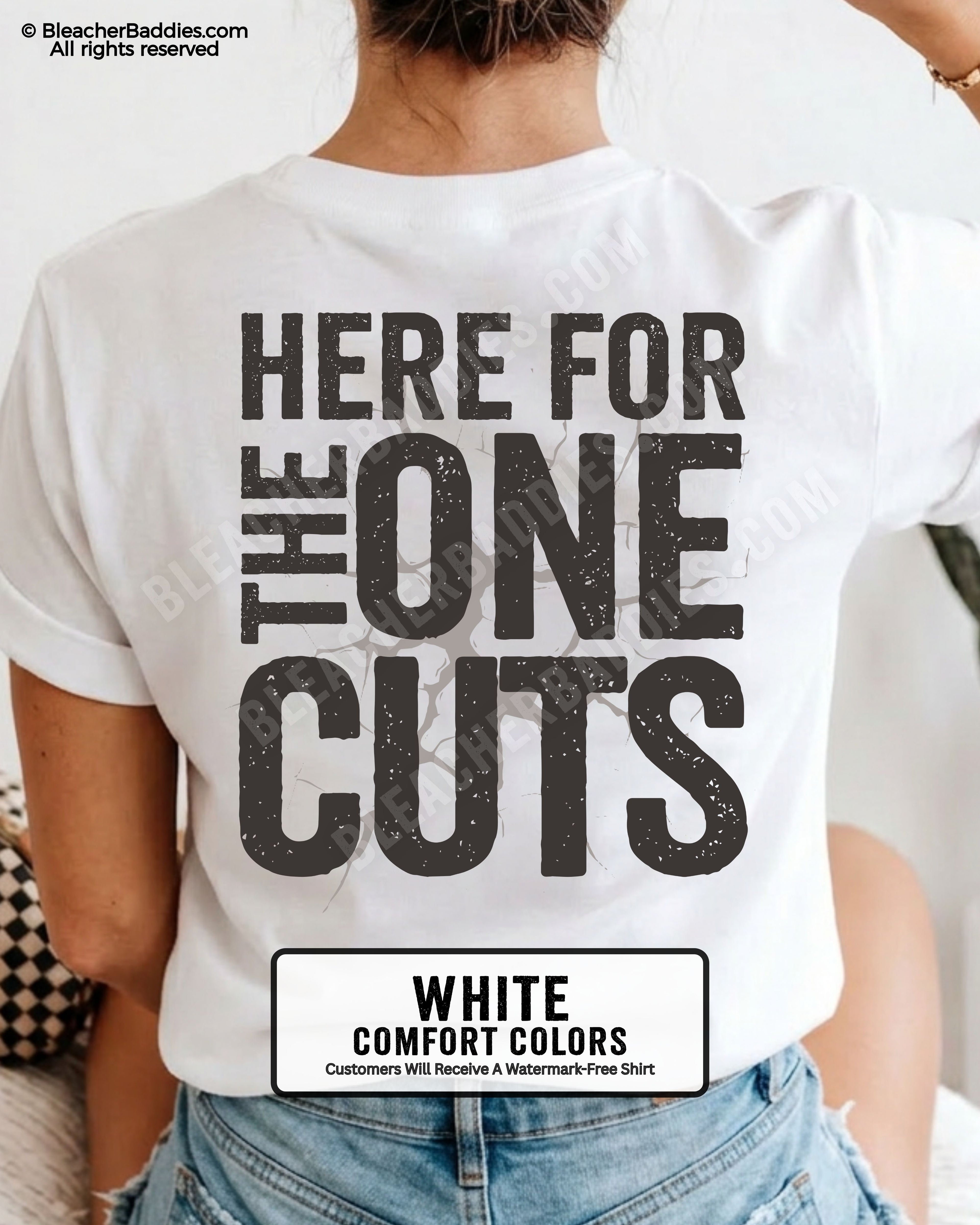close-up back view of white comfort colors football mom game day shirt with “here for the one cuts” design printed on the back