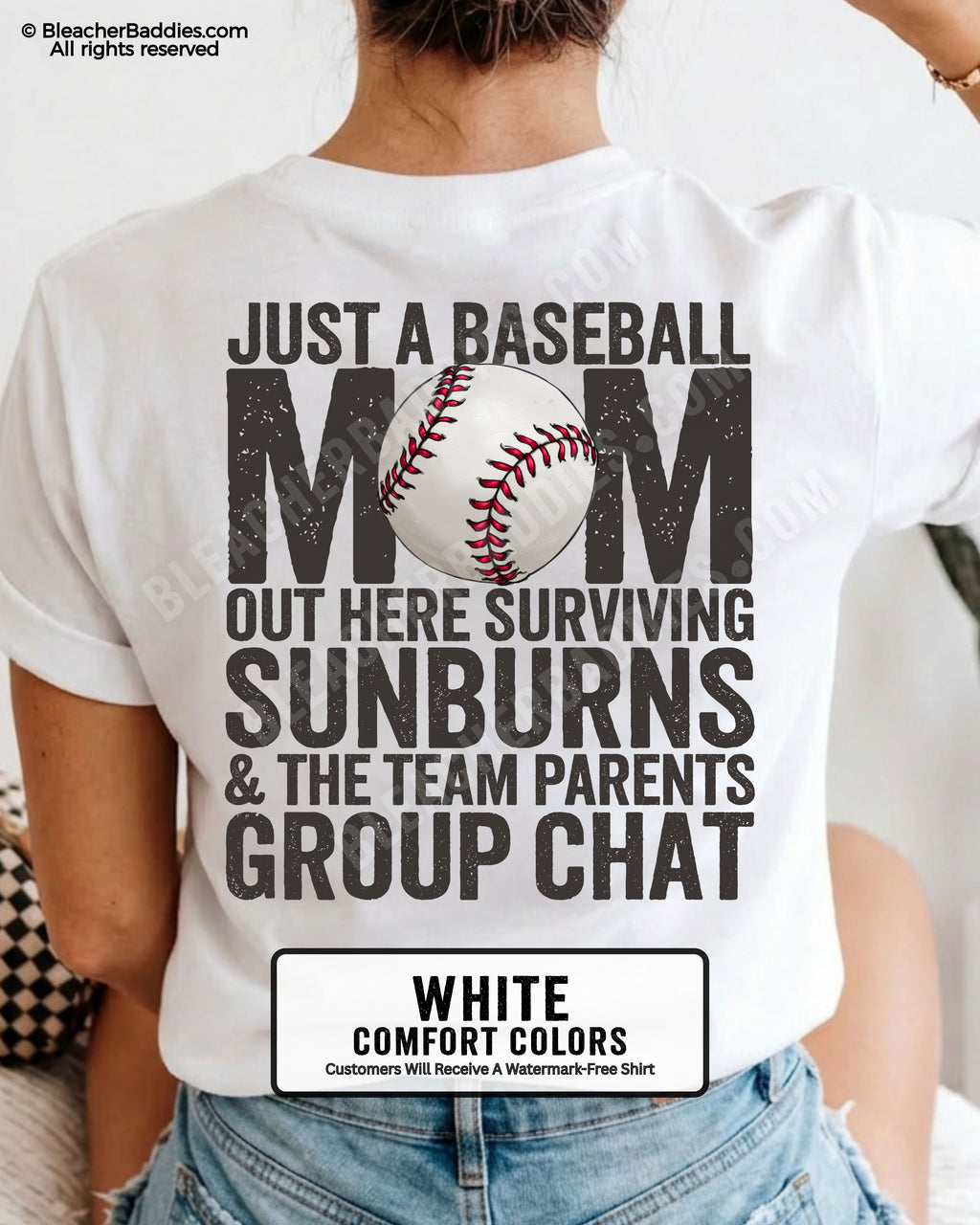 White Comfort Colors game day shirt worn by woman showing distressed back graphic reading “Just a Baseball Mom Out Here Surviving Sunburns & The Team Parents Group Chat” with baseball illustration layered over MOM text