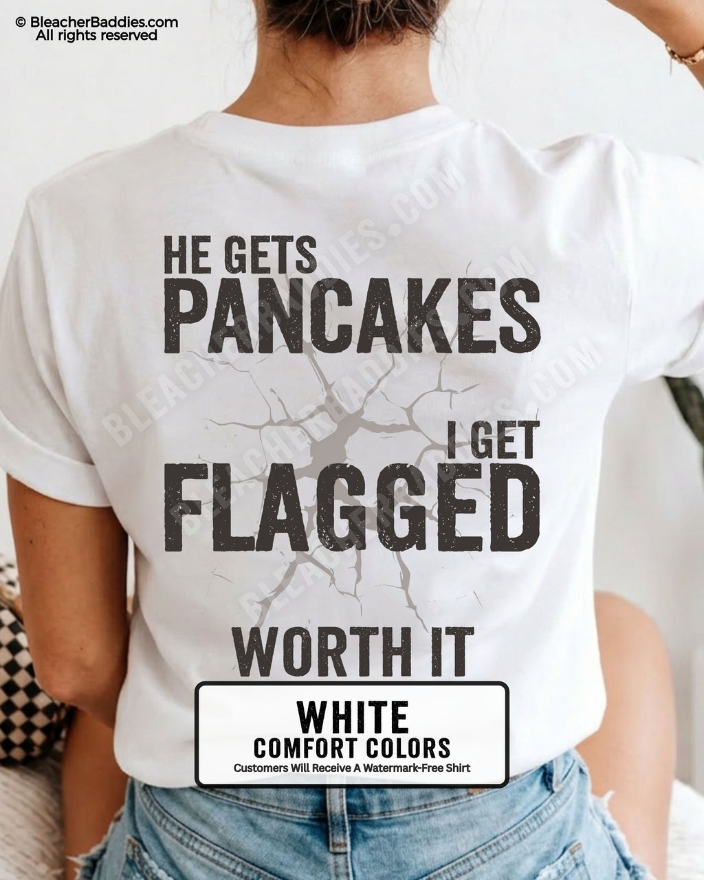 Football mom game day shirt in WHITE with back design that reads “He gets pancakes I get flagged worth it” in distressed black text with cracked graphic