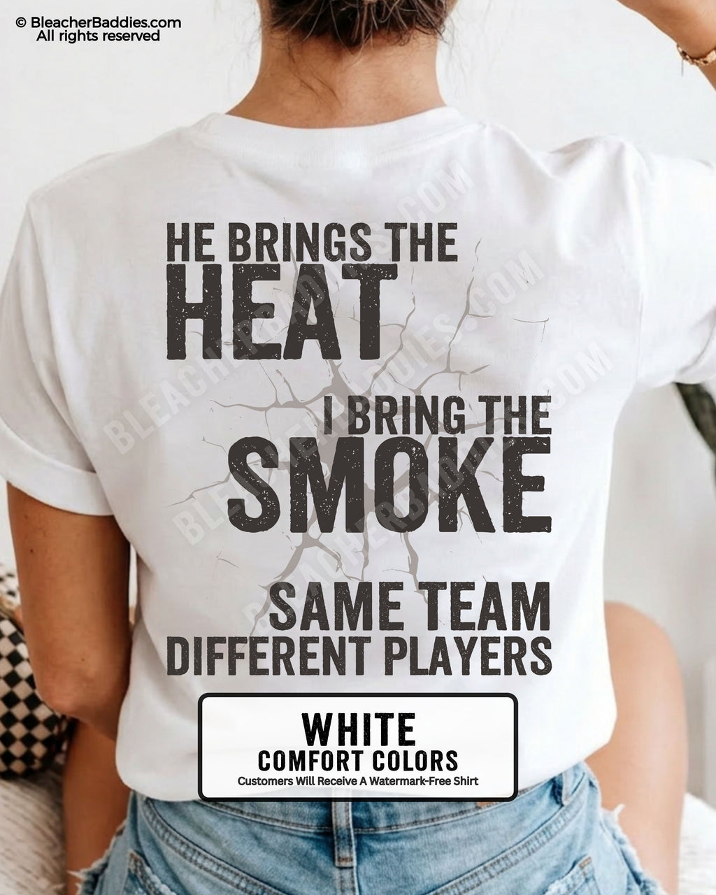 Woman wearing WHITE Comfort Colors shirt with distressed text reading “He Brings The Heat I Bring The Smoke Same Team Different Players.”