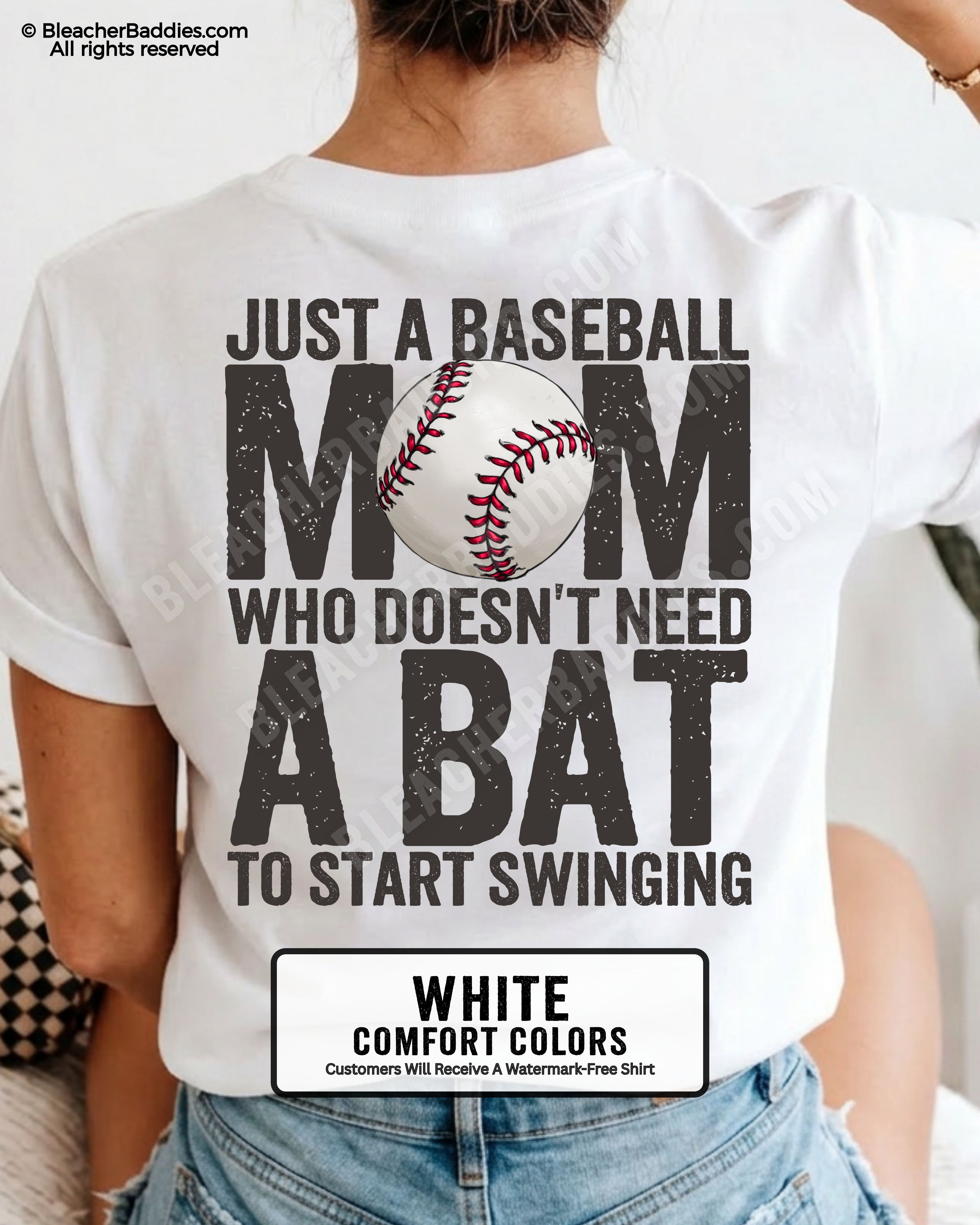 White Comfort Colors game day shirt worn by woman showing distressed back graphic reading “Just a Baseball Mom Who Doesn’t Need A Bat To Start Swinging” with baseball illustration layered over MOM text